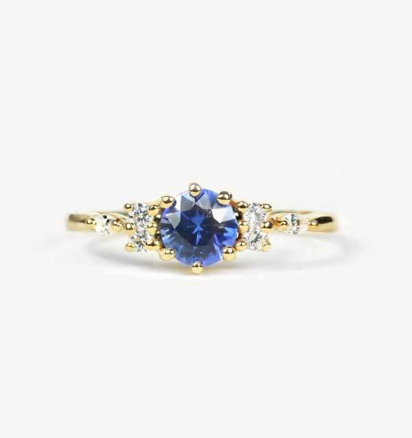 blue sapphire engagement ring in yellow gold