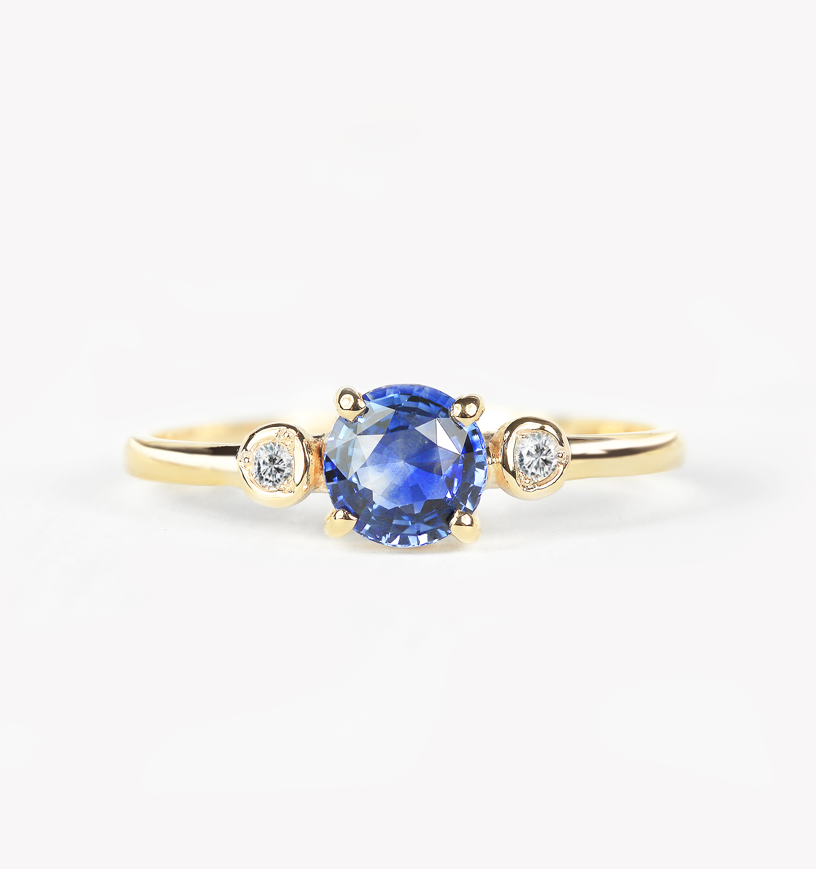 blue sapphire engagement ring made in yellow gold