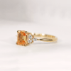 Peach sapphire engagement ring in yellow gold