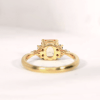peach sapphire engagement ring in yellow gold