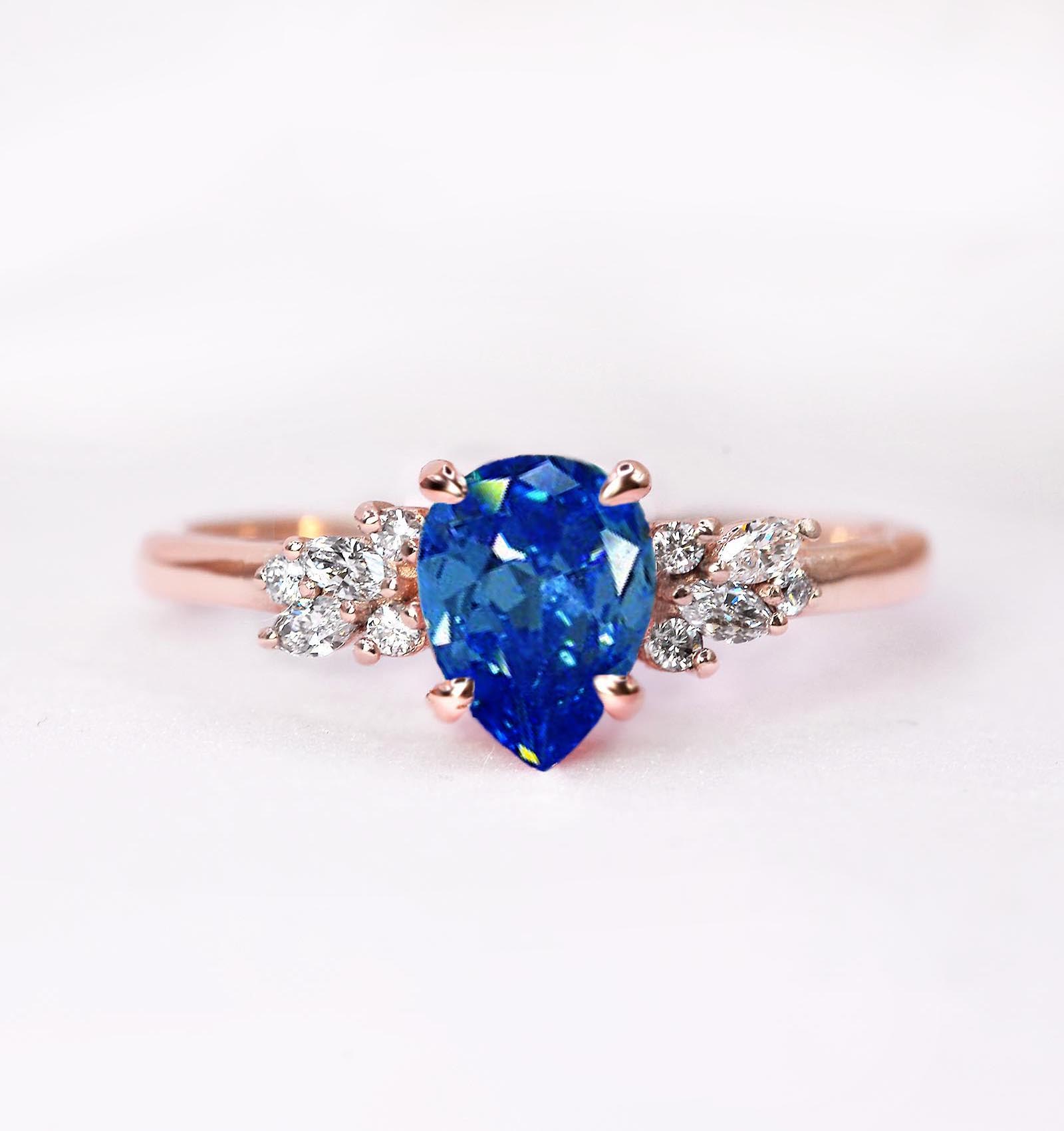 medium blue sapphire and diamond rose gold ring