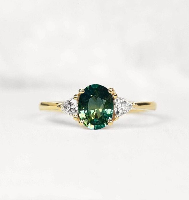 oval teal sapphire and diamond ring