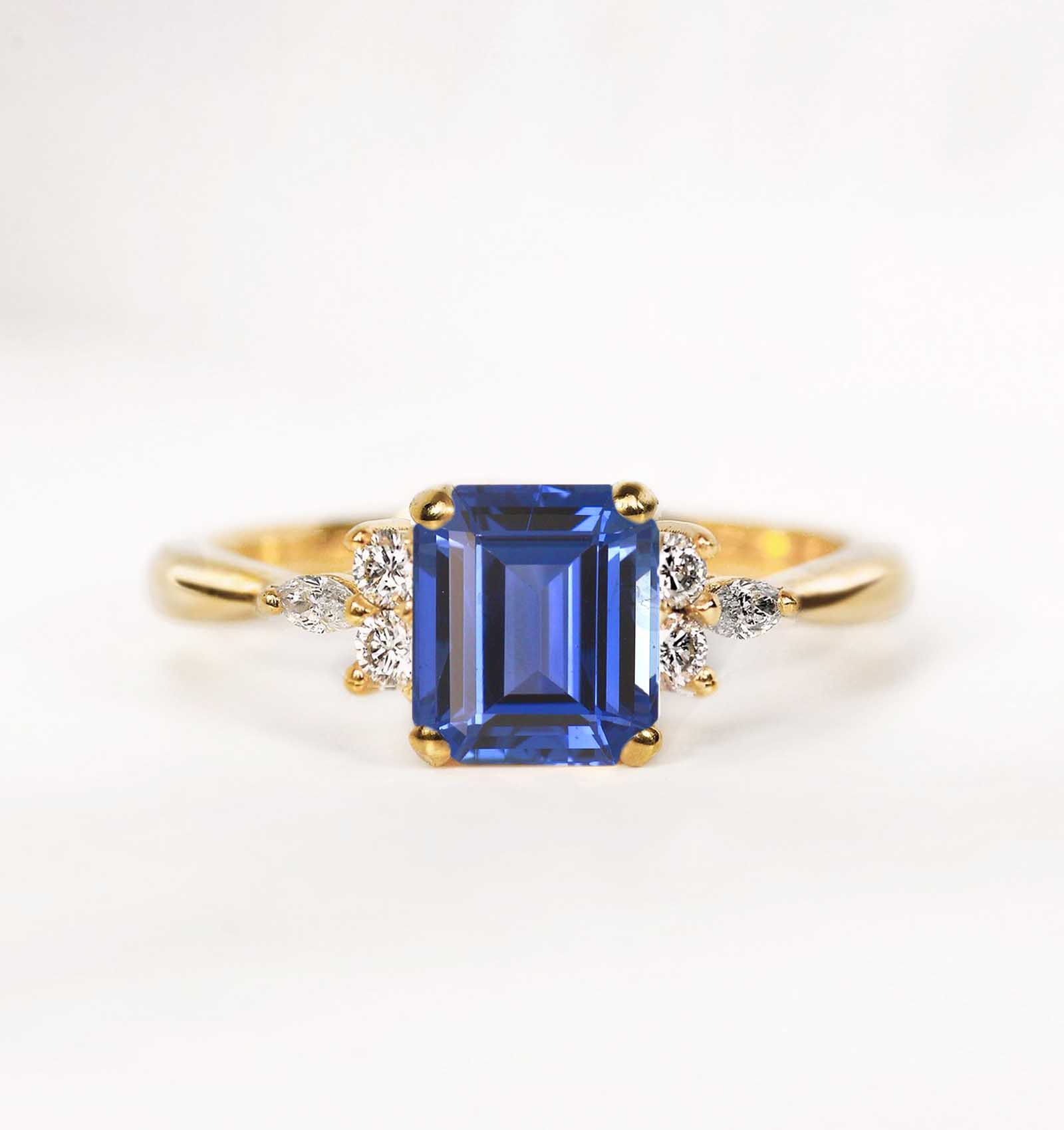 blue sapphire and diamond engagement ring in yellow gold
