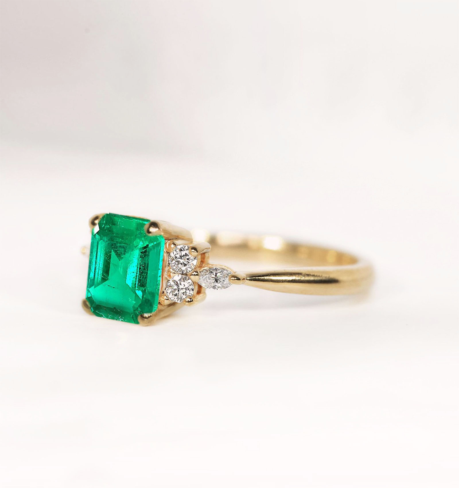 emerald dainty engagement ring in rose gold