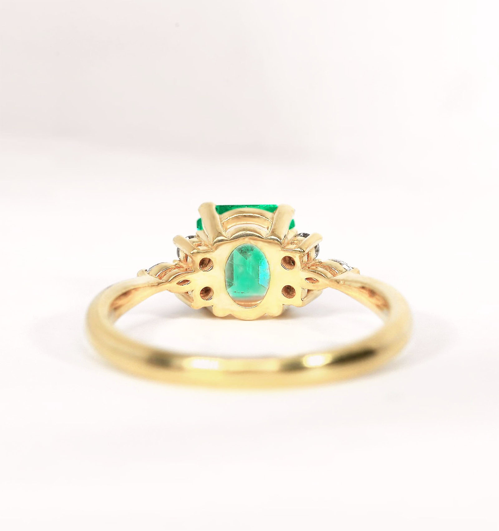engagement ring with emeralds rear view
