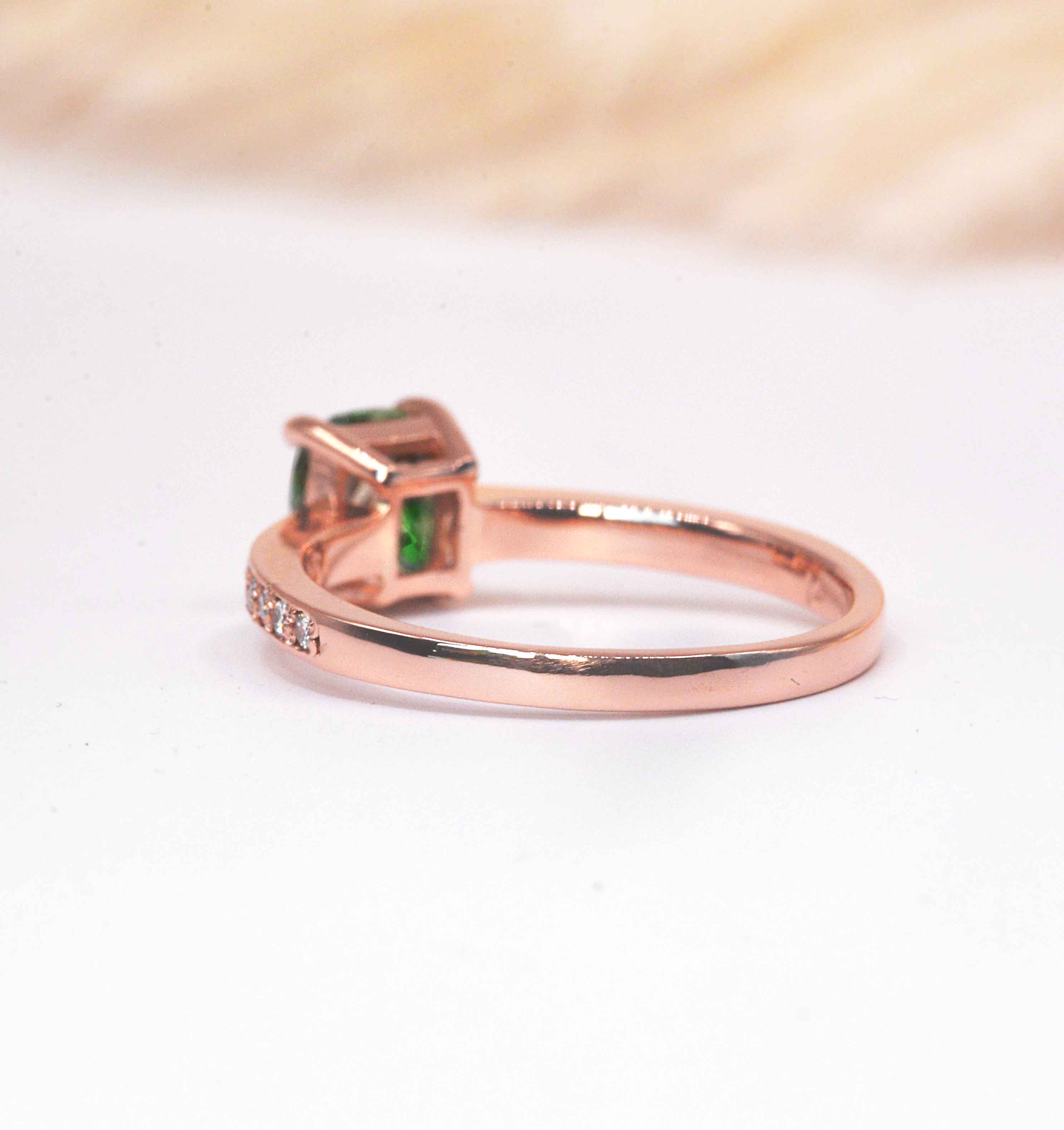 cushion cut diamond and green tsavorite ring