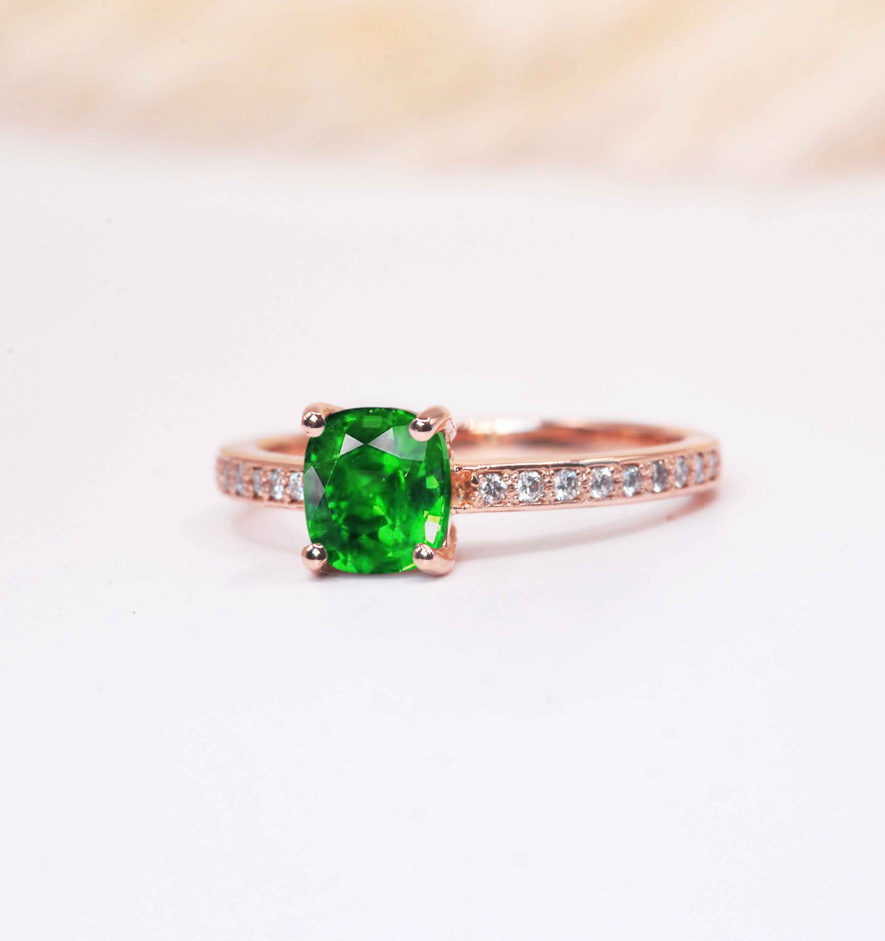 cushion cut diamond and green tsavorite ring