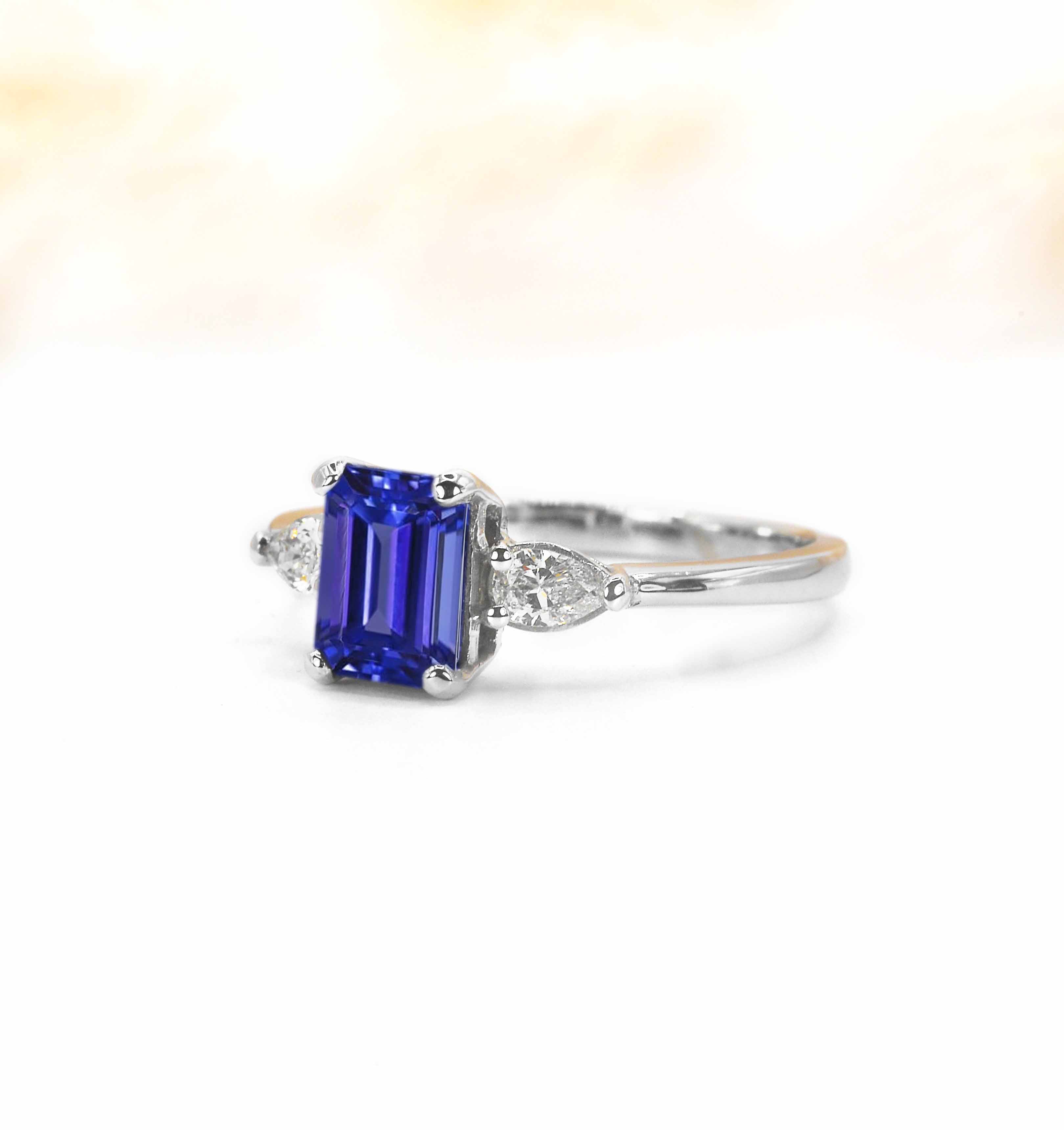 emerald cut blue sapphire and diamond engagement ring