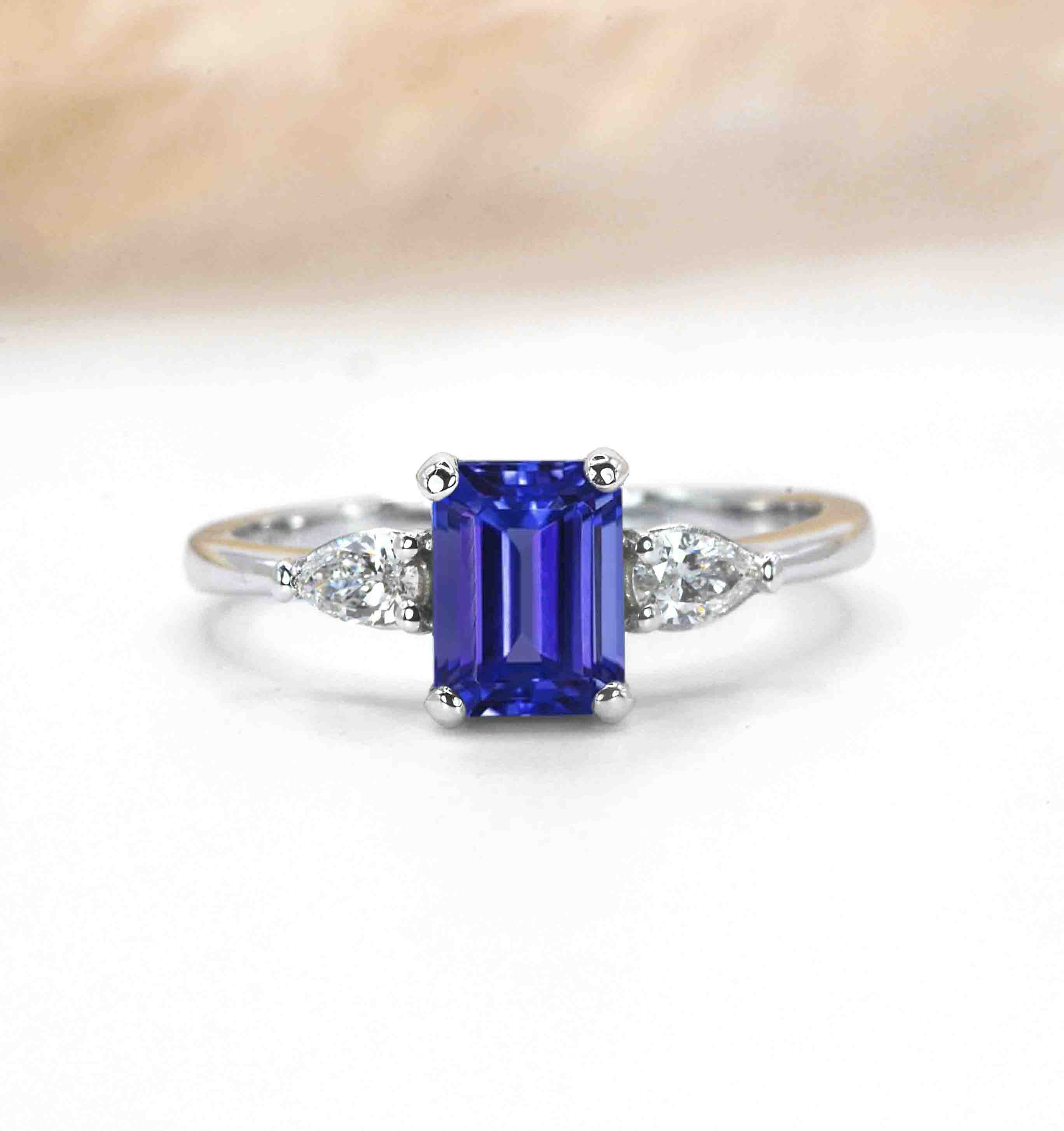 emerald cut blue sapphire and diamond engagement ring