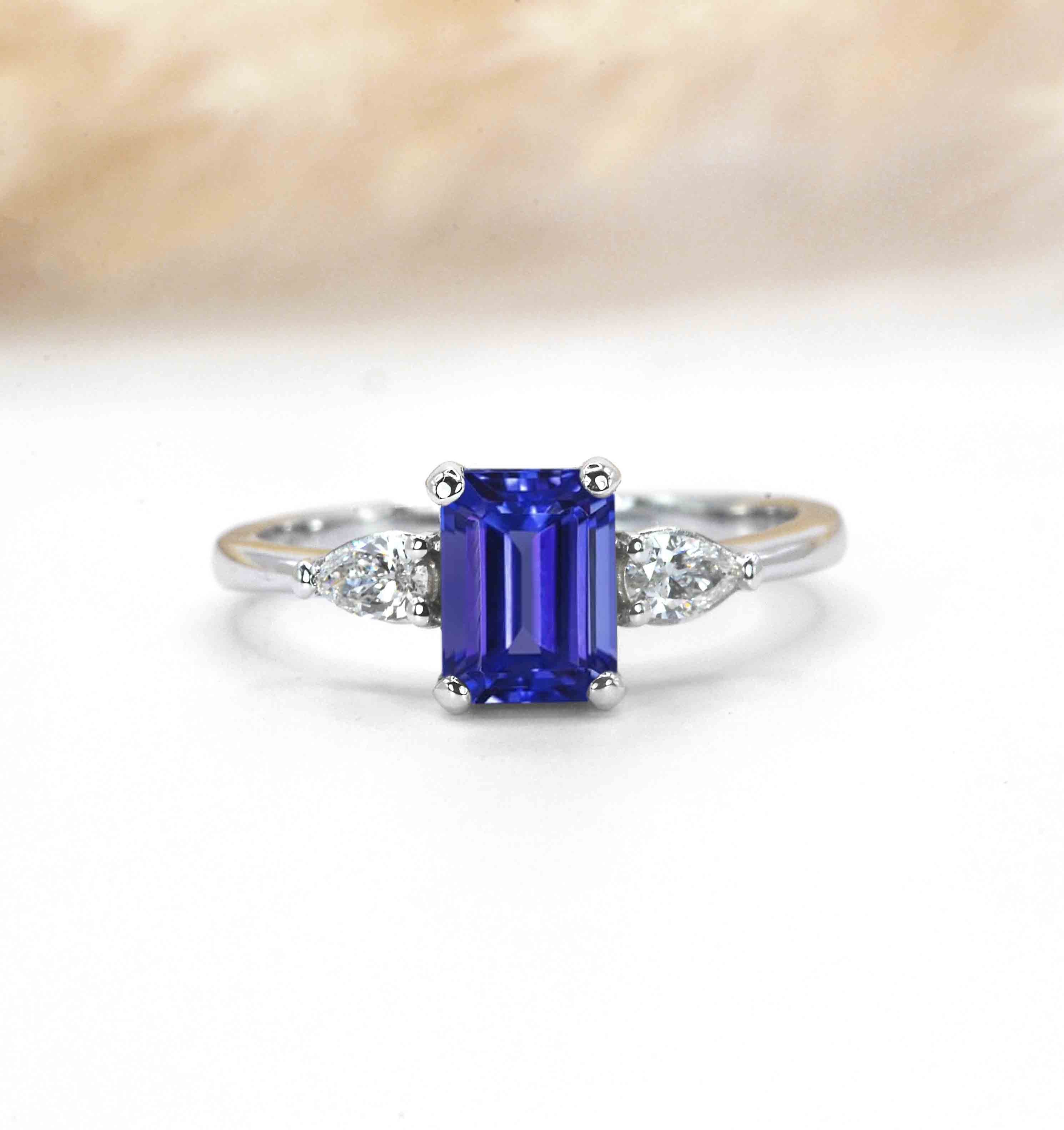 emerald cut blue sapphire and diamond engagement ring