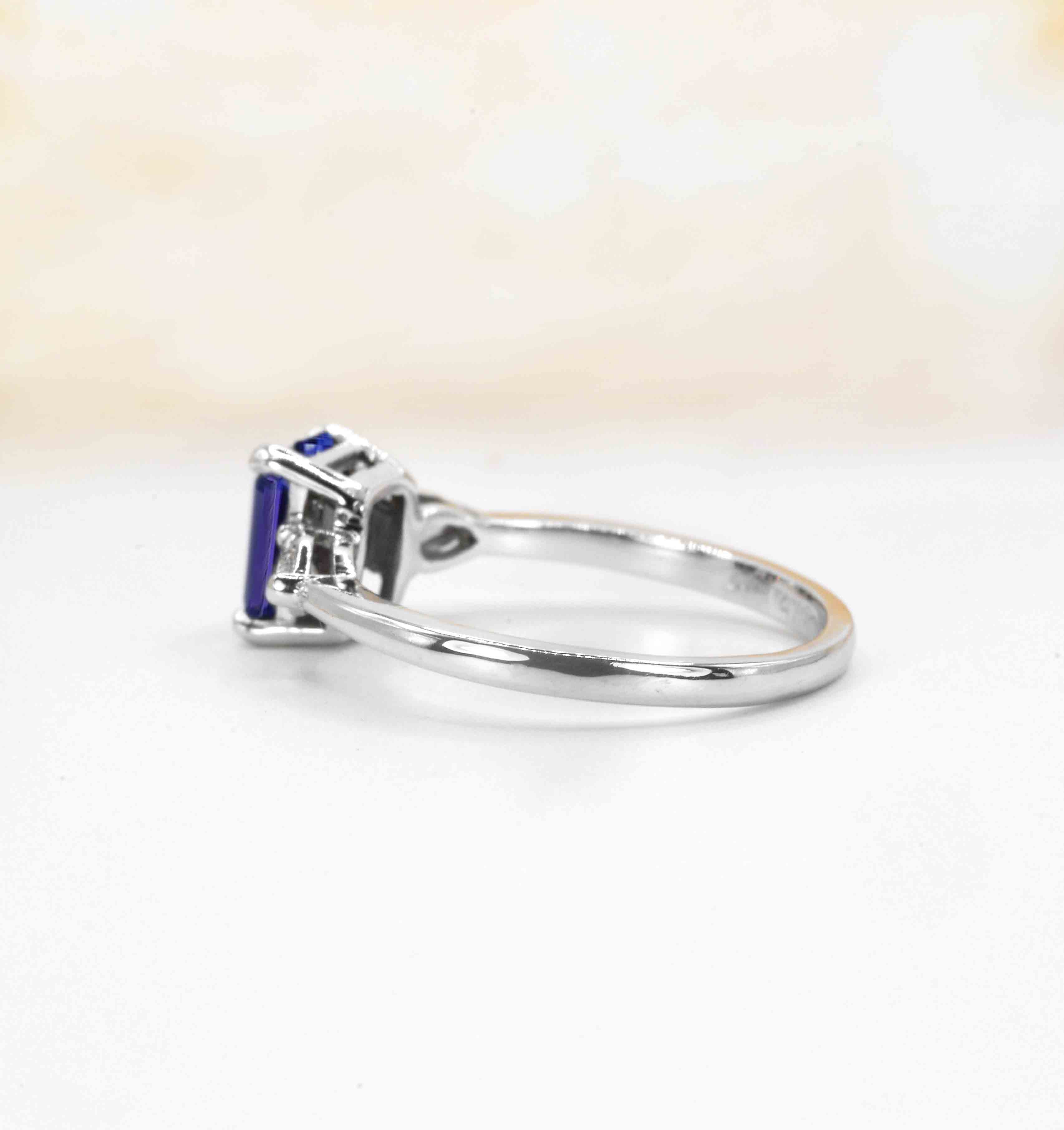 emerald cut blue sapphire and diamond engagement ring