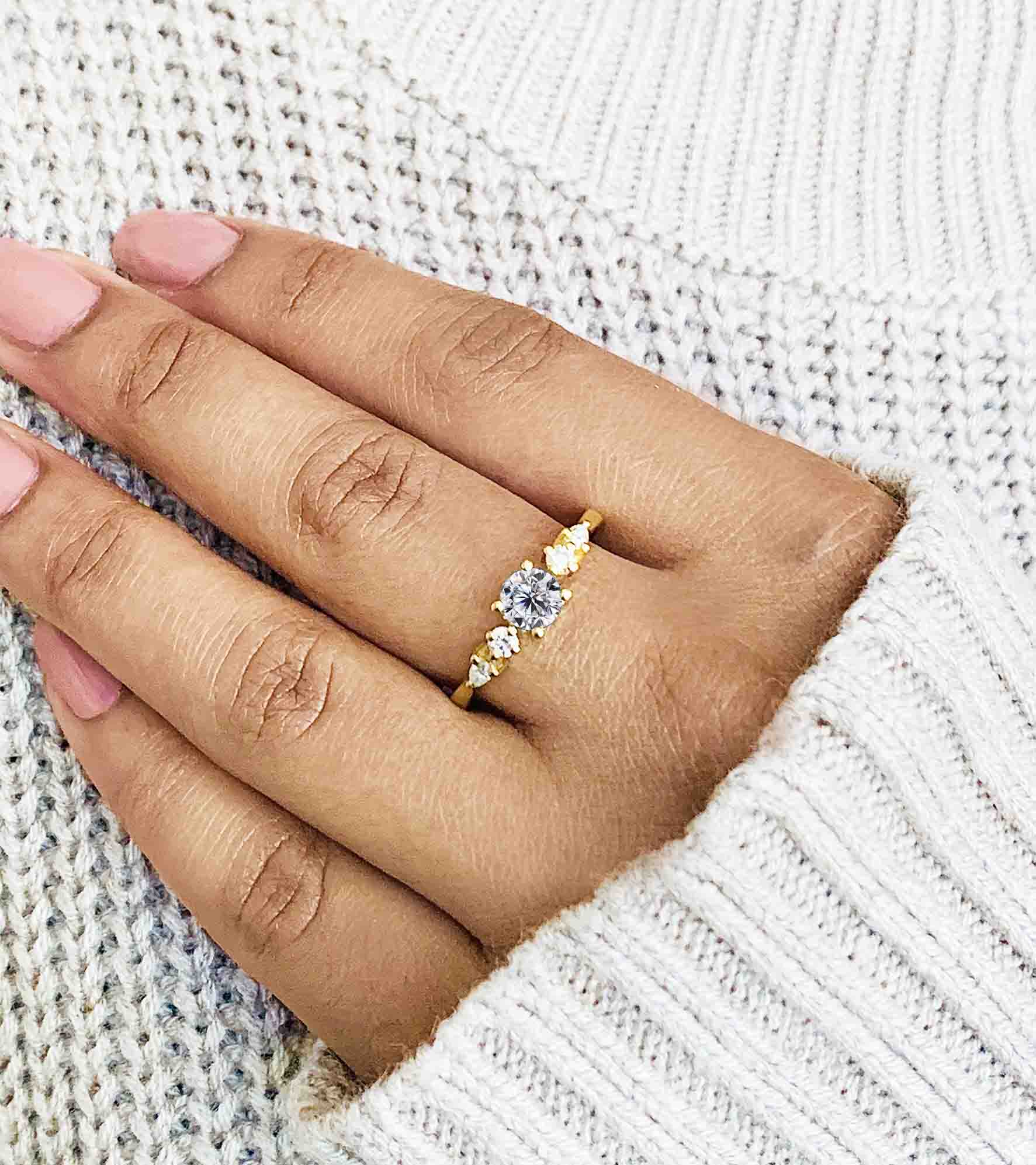 dainty white moissanite and diamond art deco ring