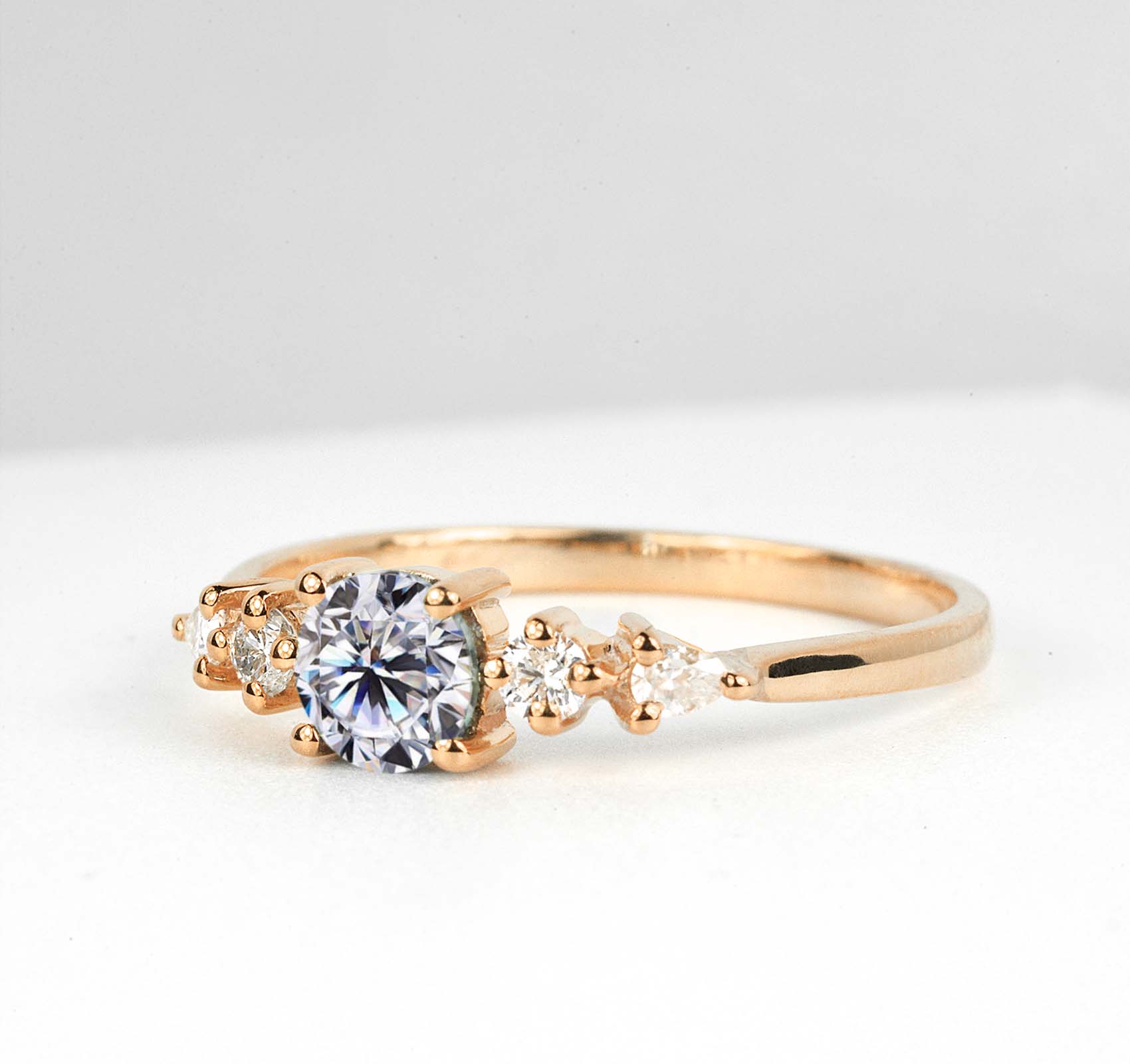 dainty white moissanite and diamond art deco ring