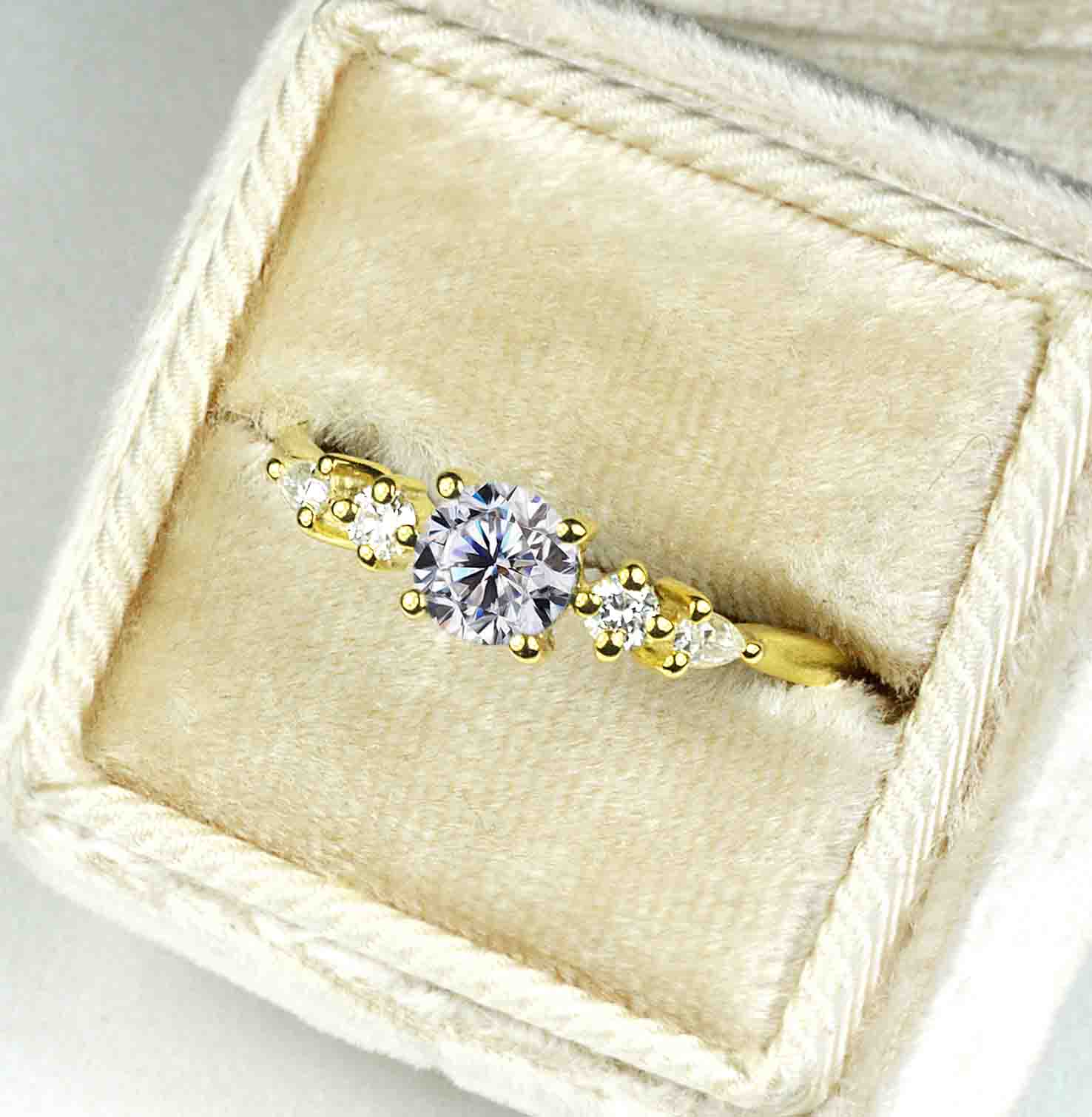 dainty white moissanite and diamond art deco ring