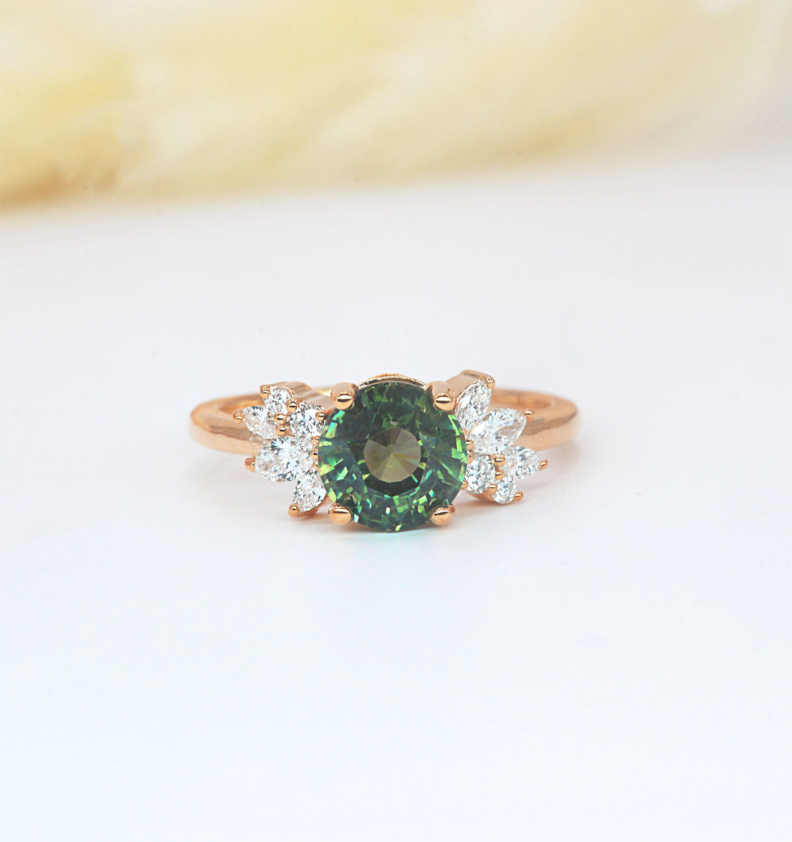 teal solitaire cluster ring