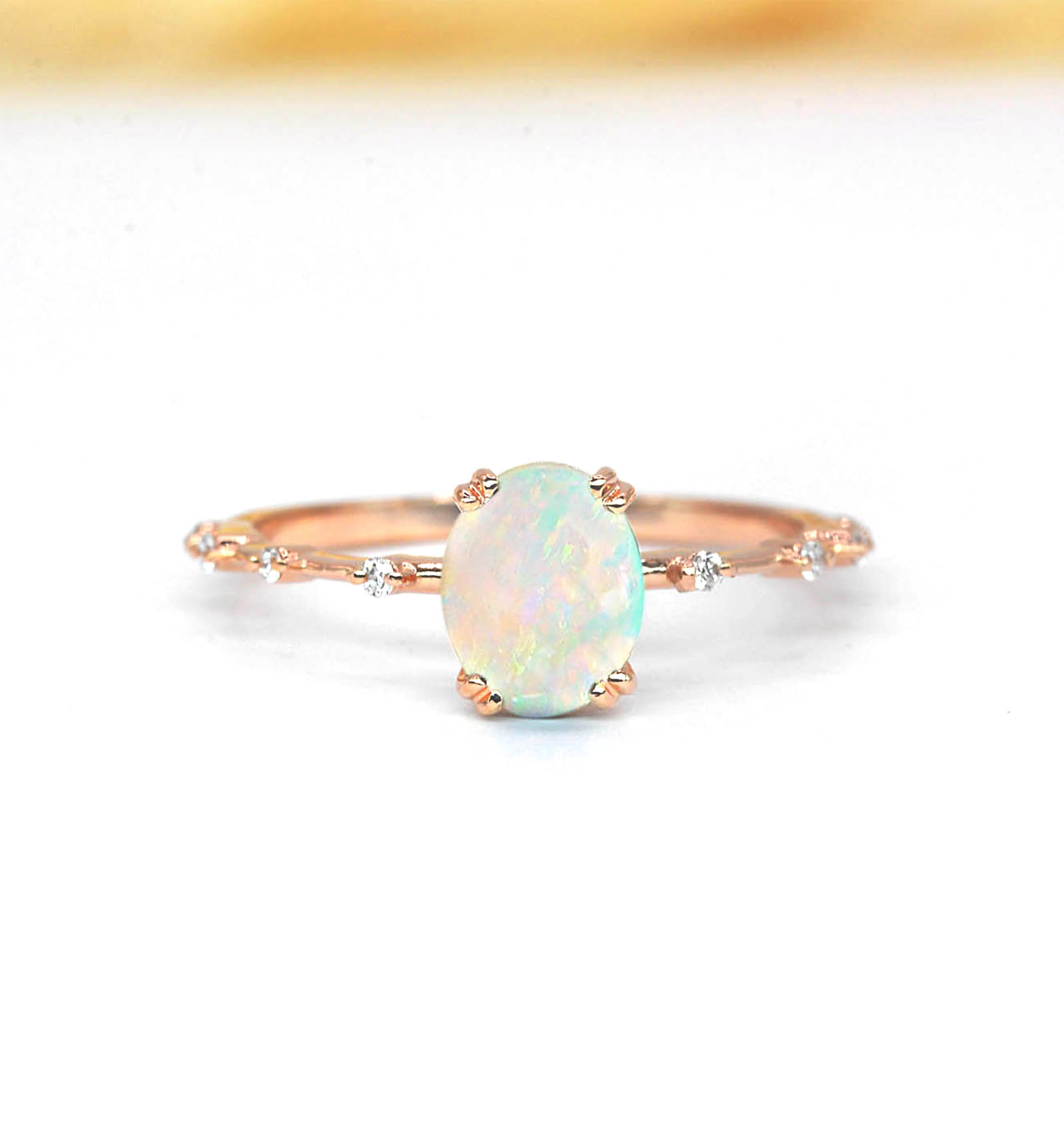 delicate opal and diamond ring