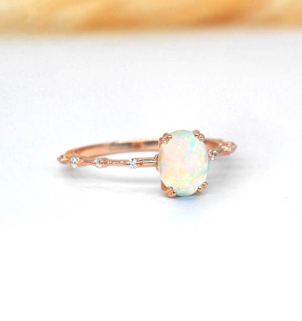 delicate opal and diamond ring