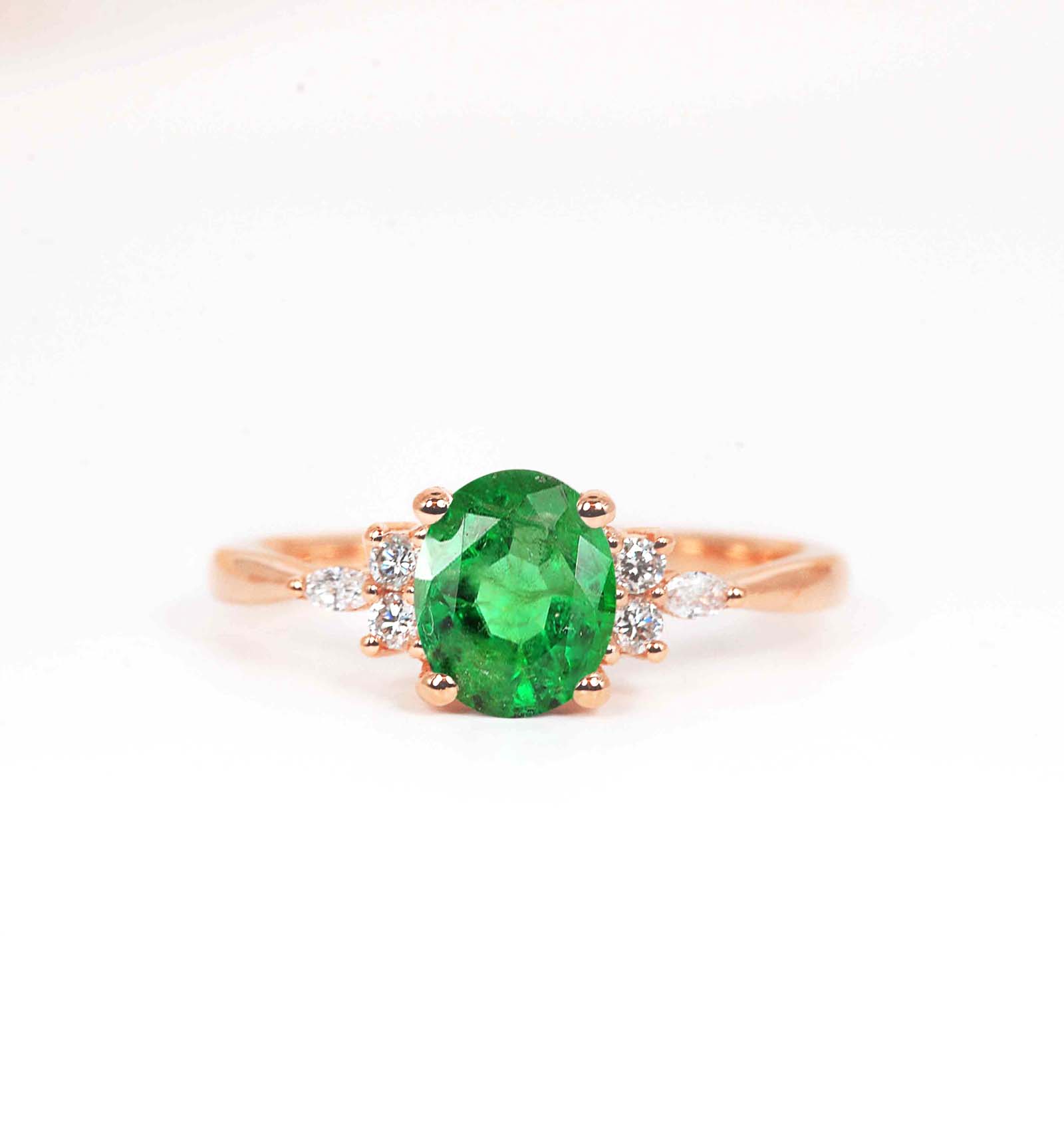 Oval emerald dainty ring with marquise diamonds