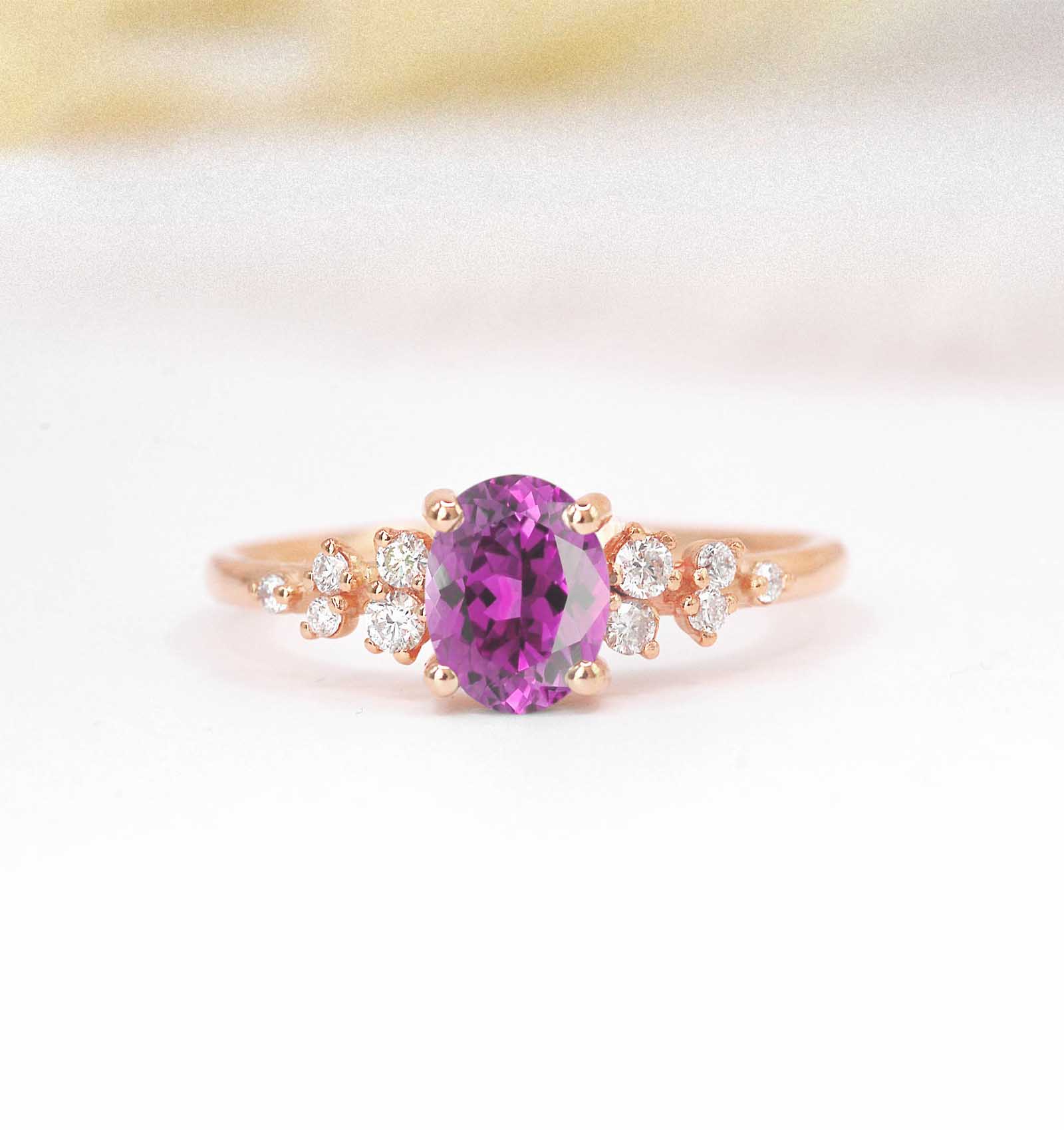 Oval pink sapphire cluster ring