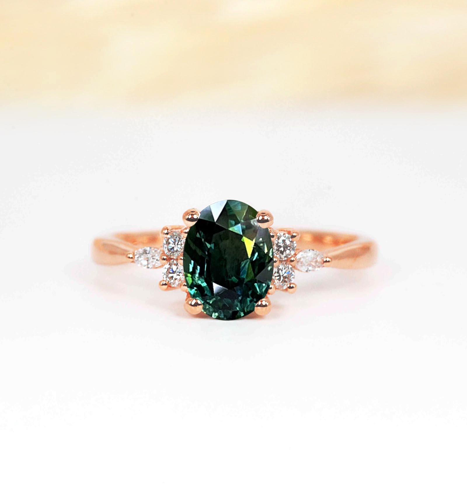 Oval teal sapphire dainty ring with marquise diamonds