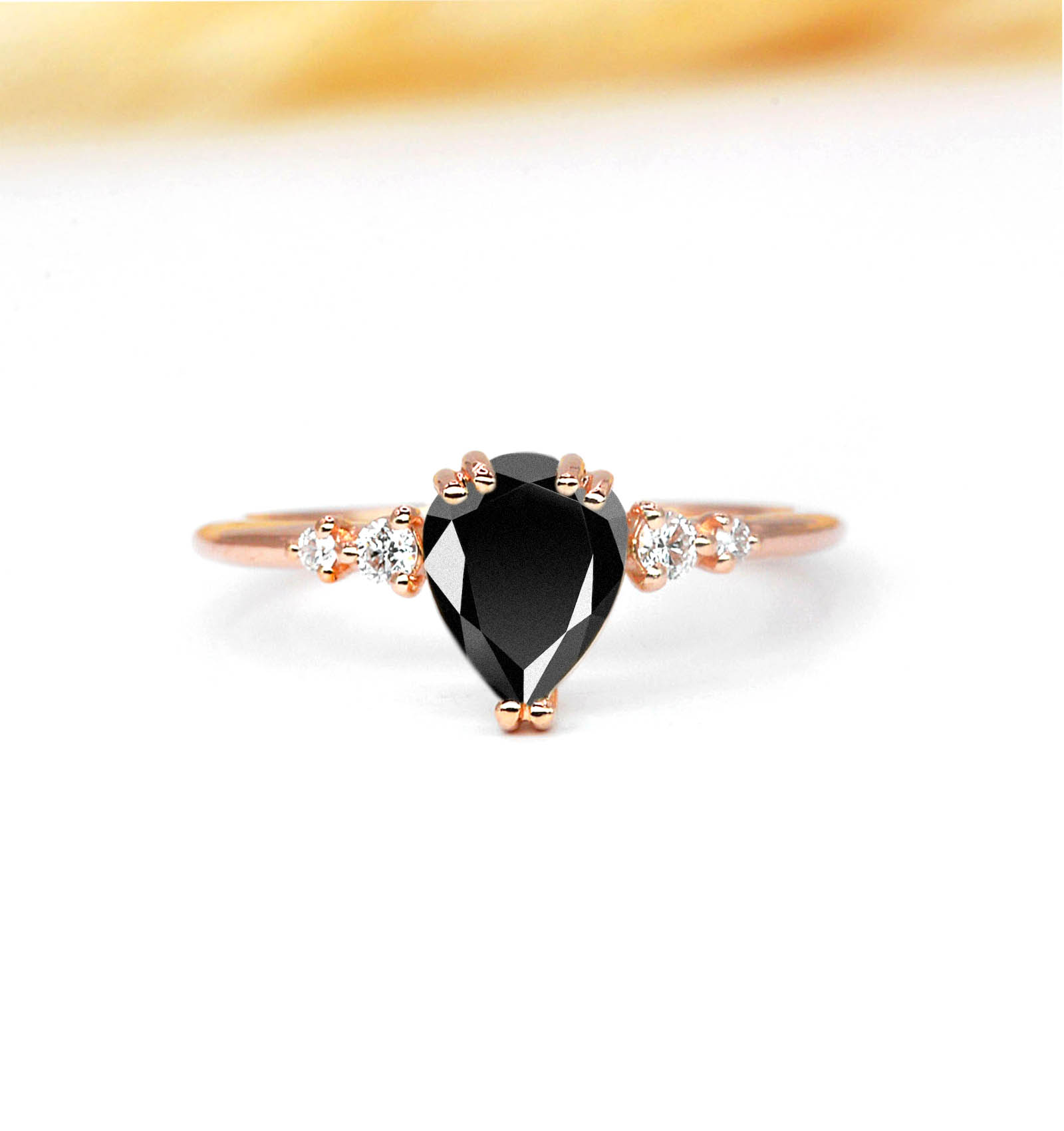 pear cut black diamond stimulant ring