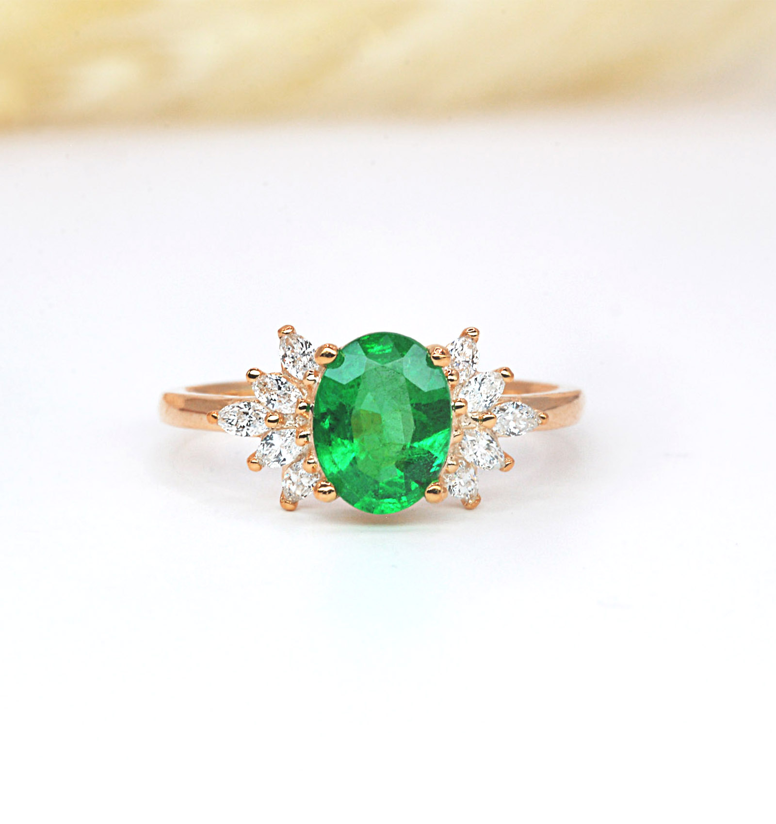 oval emerald high engagement ring