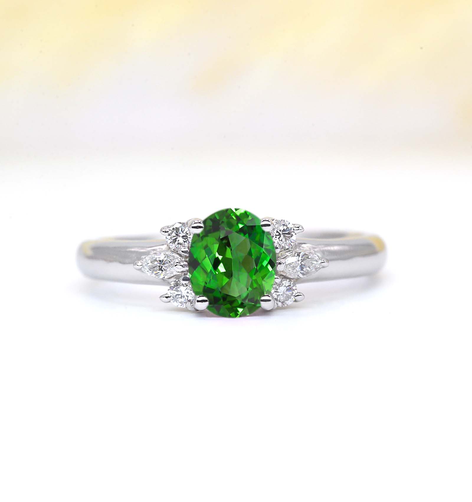 oval tsavorite featuring cluster engagement ring