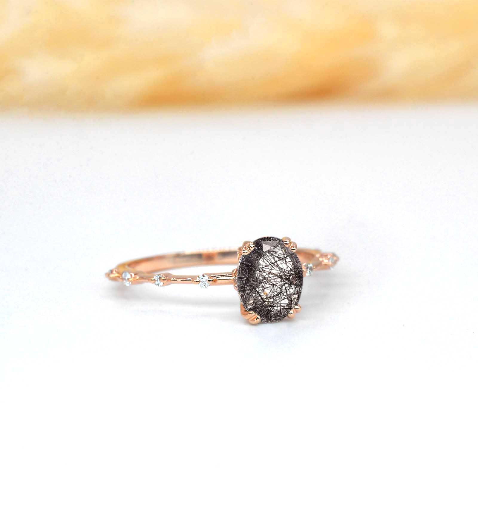 oval shape rutile anniversary ring