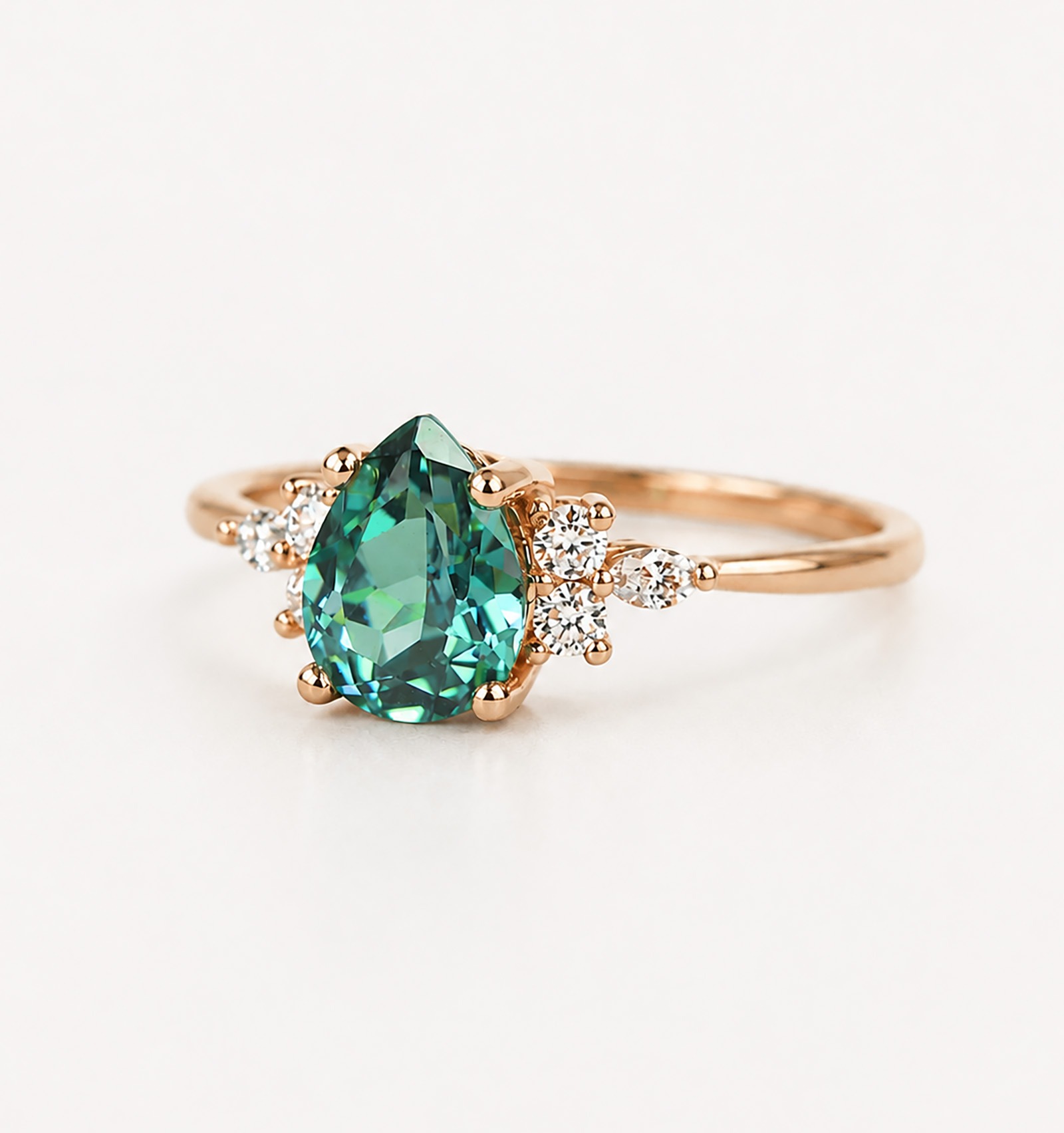 Rose gold teal sapphire engagemetn ring