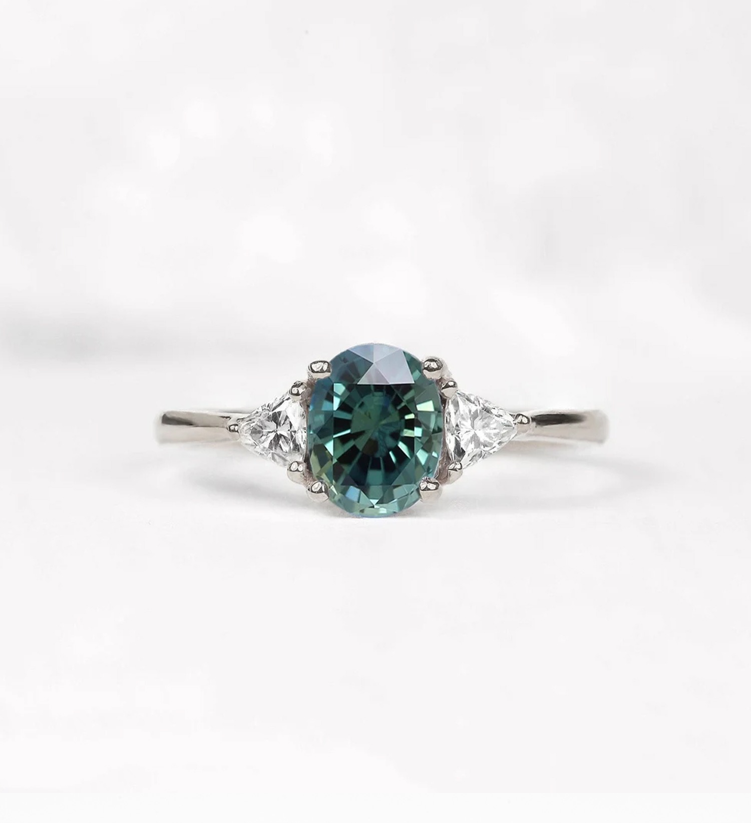 Oval teal sapphire art deco ring