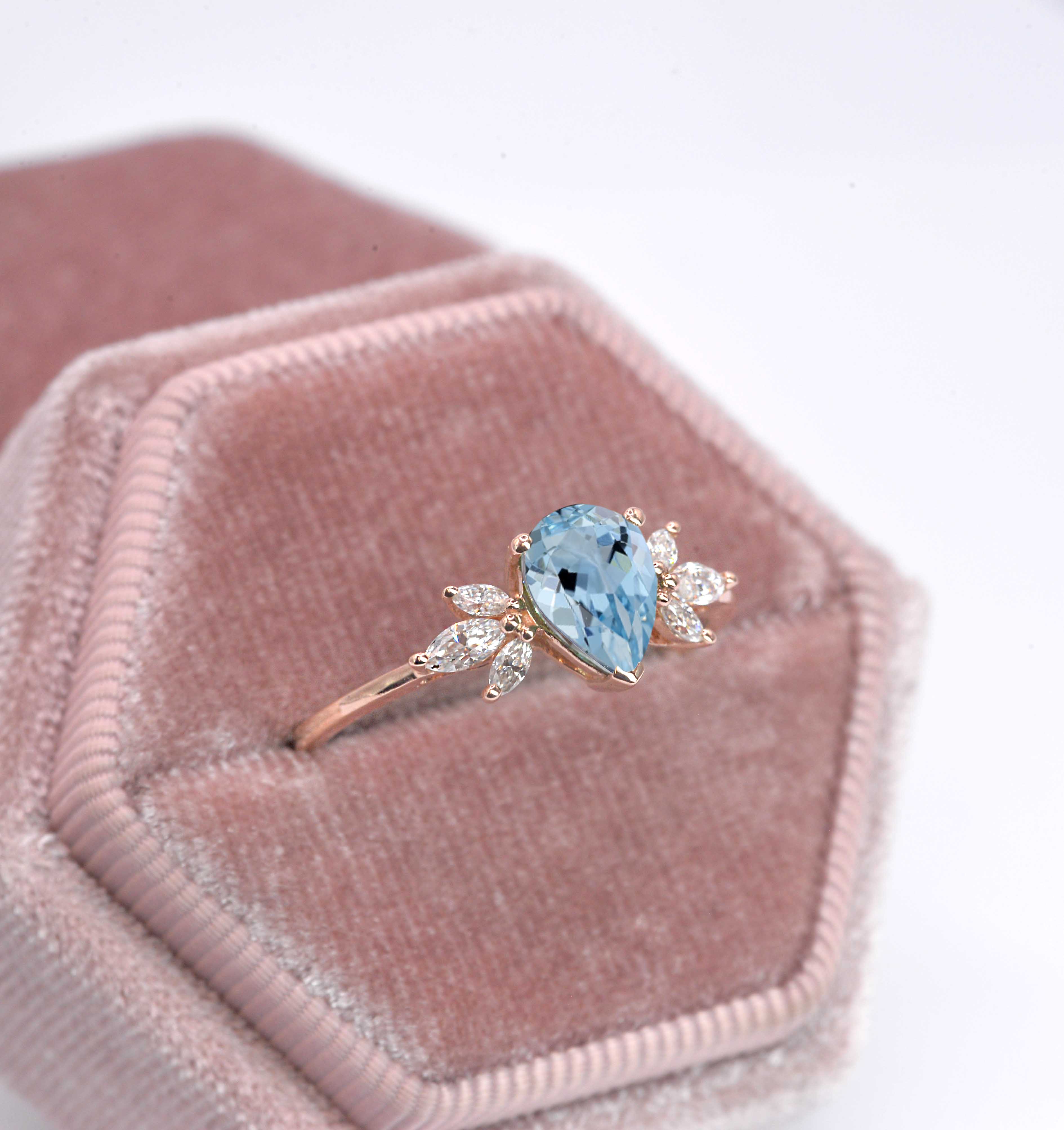 1.5ct pear cut aquamarine and diamond ring with 8 x 6mm aquamarine and white marquise diamonds. The unique design of this art deco style ring comes with solid 9k,14k or 18k gold or platinum.
