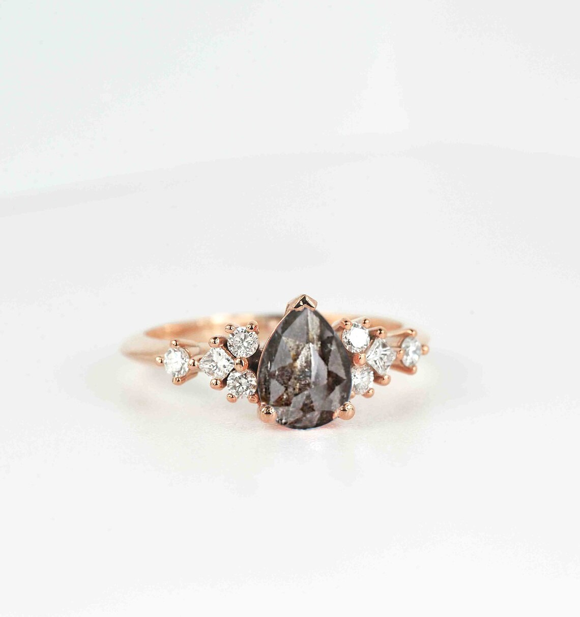 pear cut salt and pepper diamond ring with white accent diamonds. This unique art deco ring comes with solid 9k,14k or 18k rose gold.