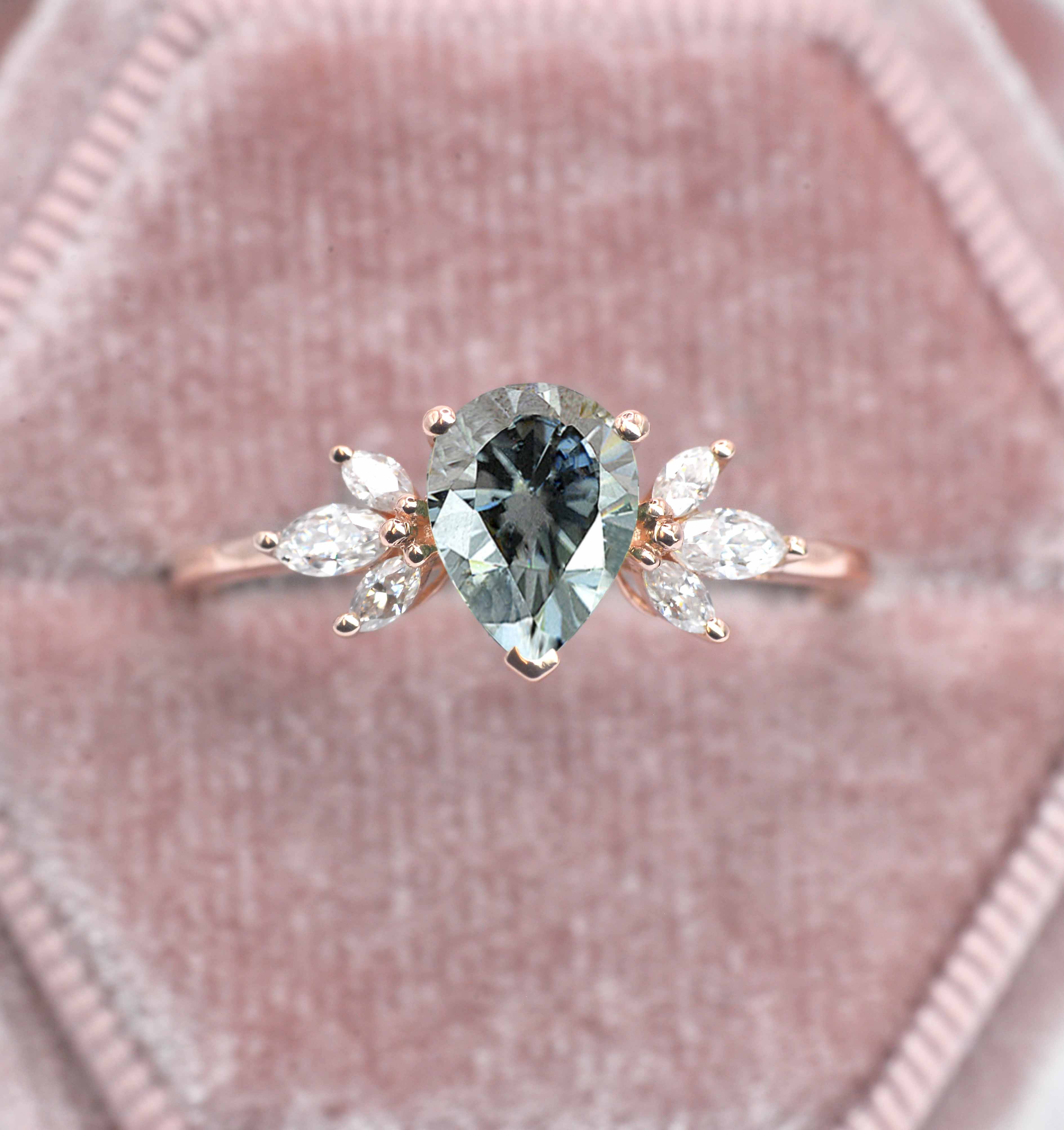 pear cut grey moissanite ring with 8 x 6mm peat cut moissanite and white marquise diamonds. The unique design of this art deco style ring comes with solid 9k,14k or 18k gold or platinum.