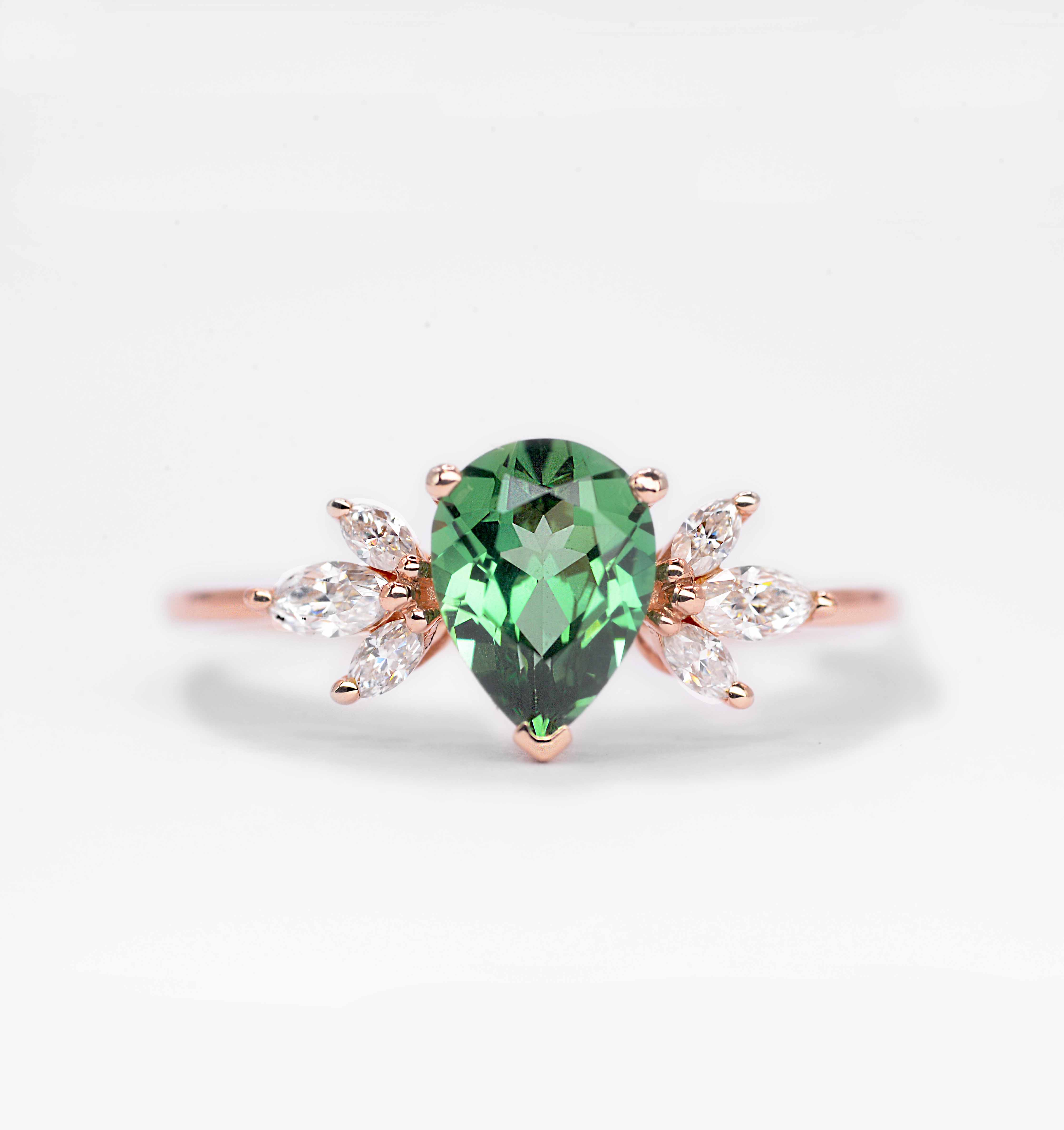 This elegant and beautiful mint green sapphire and marquise diamond ring comes with a center 1.50ct mint green sapphire and white natural marquise diamonds. Available in 9k/14k/18k rose gold, yellow gold, white gold, or platinum. A perfect blend of modern charm and traditional elegance for her.