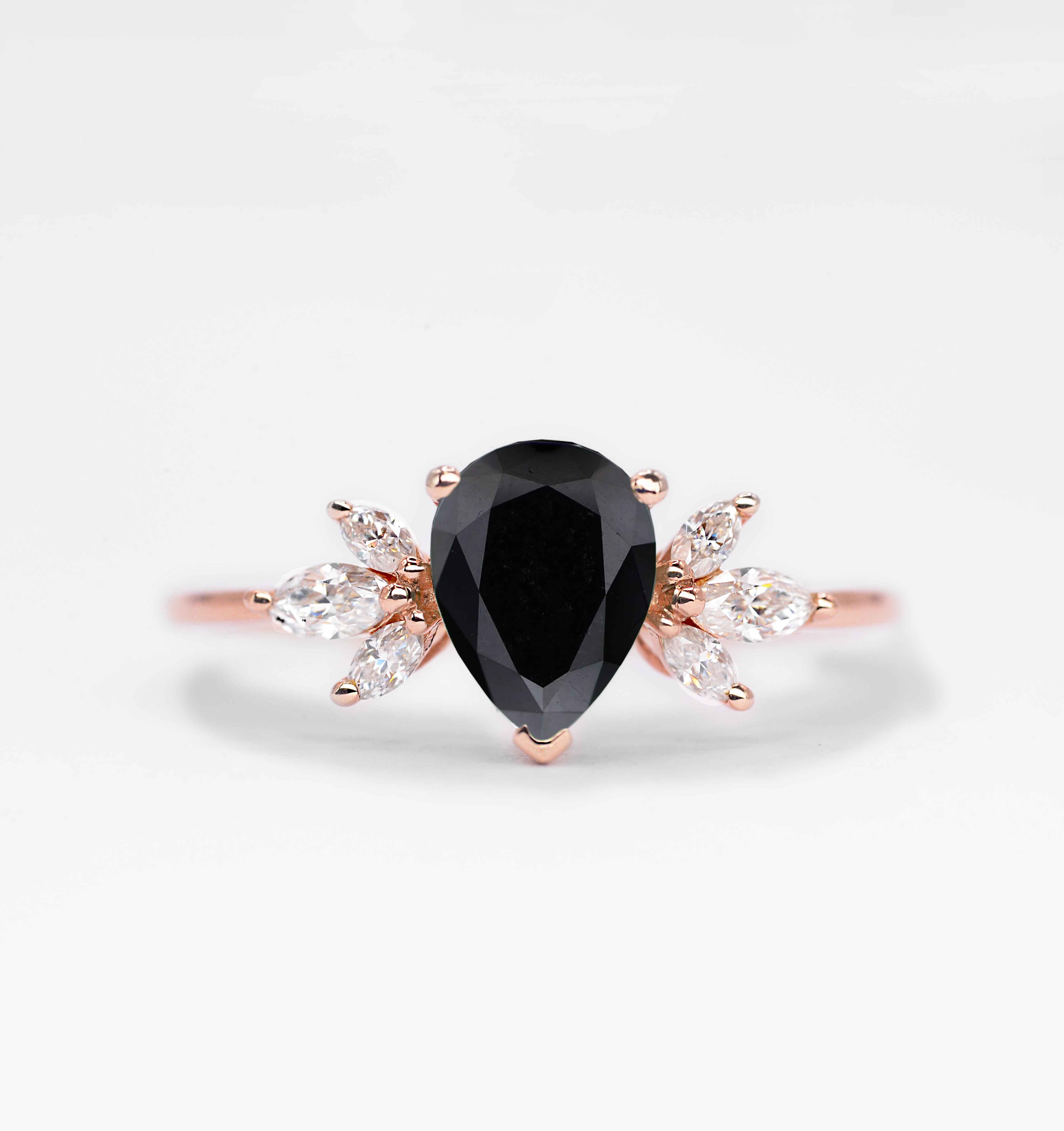 black diamond art deco engagement ring with 8 x 6mm peat cut black diamond and white marquise diamonds. The unique design of this art deco style ring comes with solid 9k,14k or 18k gold or platinum.