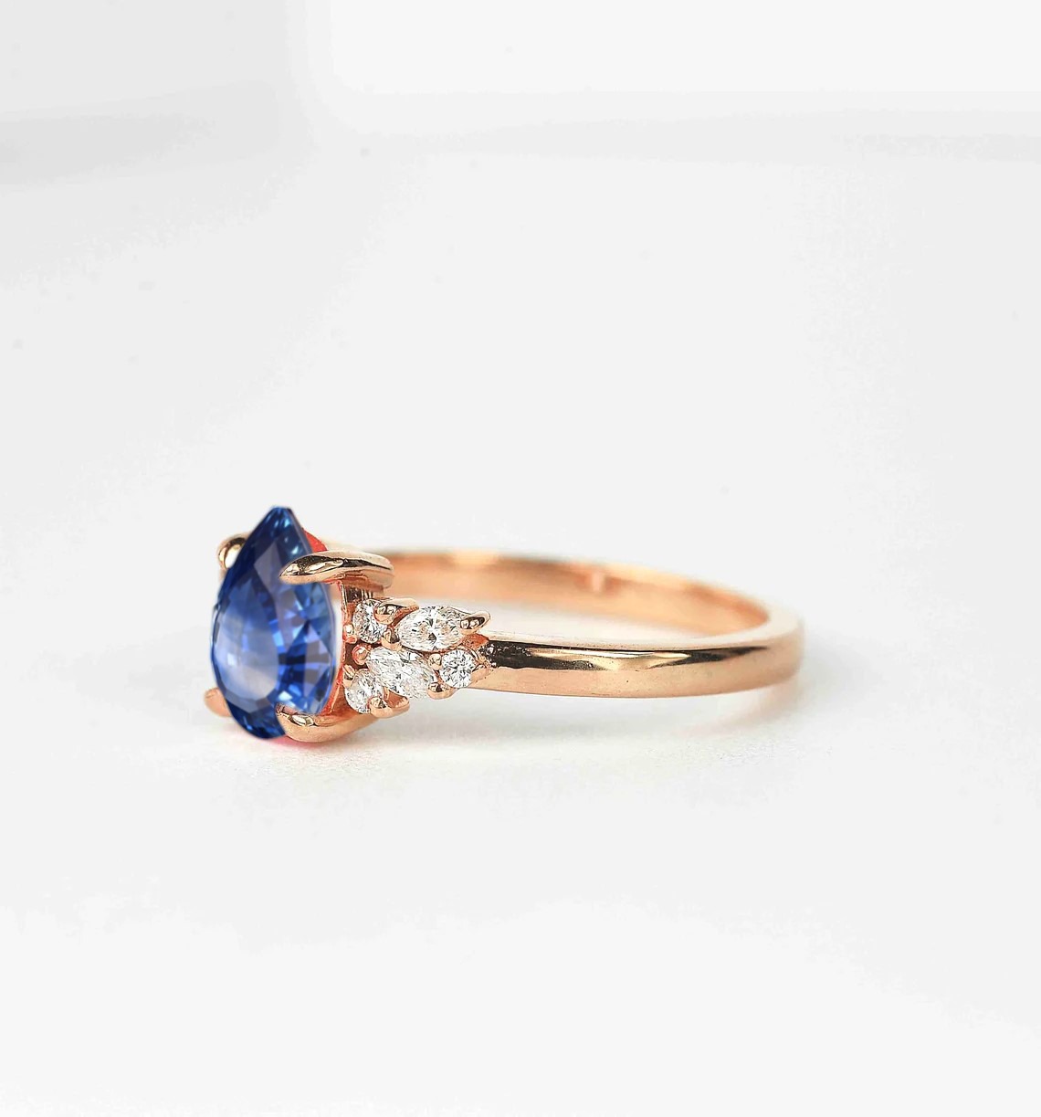 blue sapphire and diamond ring with black diamond and white accent diamonds. This unique art deco ring comes with solid 9k,14k or 18k rose gold.