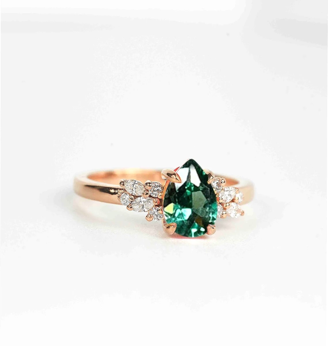mint green sapphire diamond cluster ring with 8 x 6mm mint green sapphire and white accent diamonds. The unique design of this art deco style ring comes with solid 9k,14k or 18k gold or platinum.