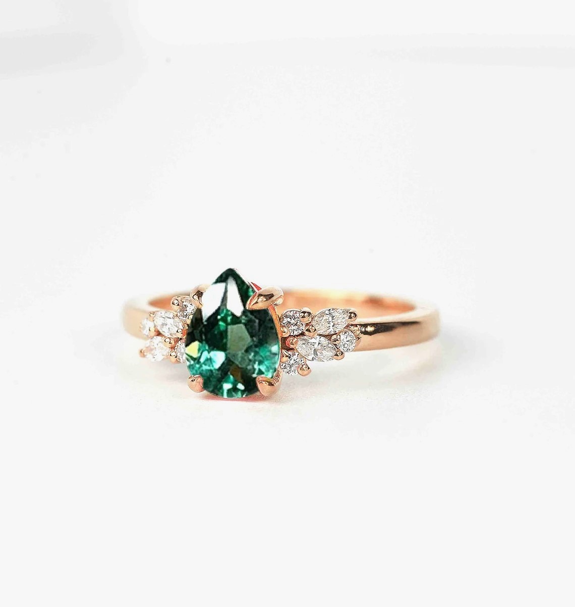 mint green sapphire diamond cluster ring with 8 x 6mm mint green sapphire and white accent diamonds. The unique design of this art deco style ring comes with solid 9k,14k or 18k gold or platinum.