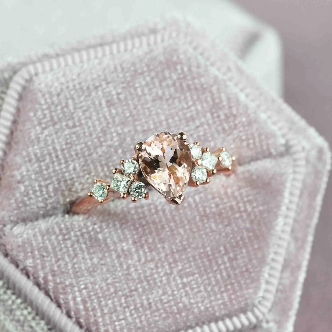 pear cut morganite unique ring with morganite and white accent diamonds. This unique art deco ring comes with solid 9k,14k or 18k rose gold.