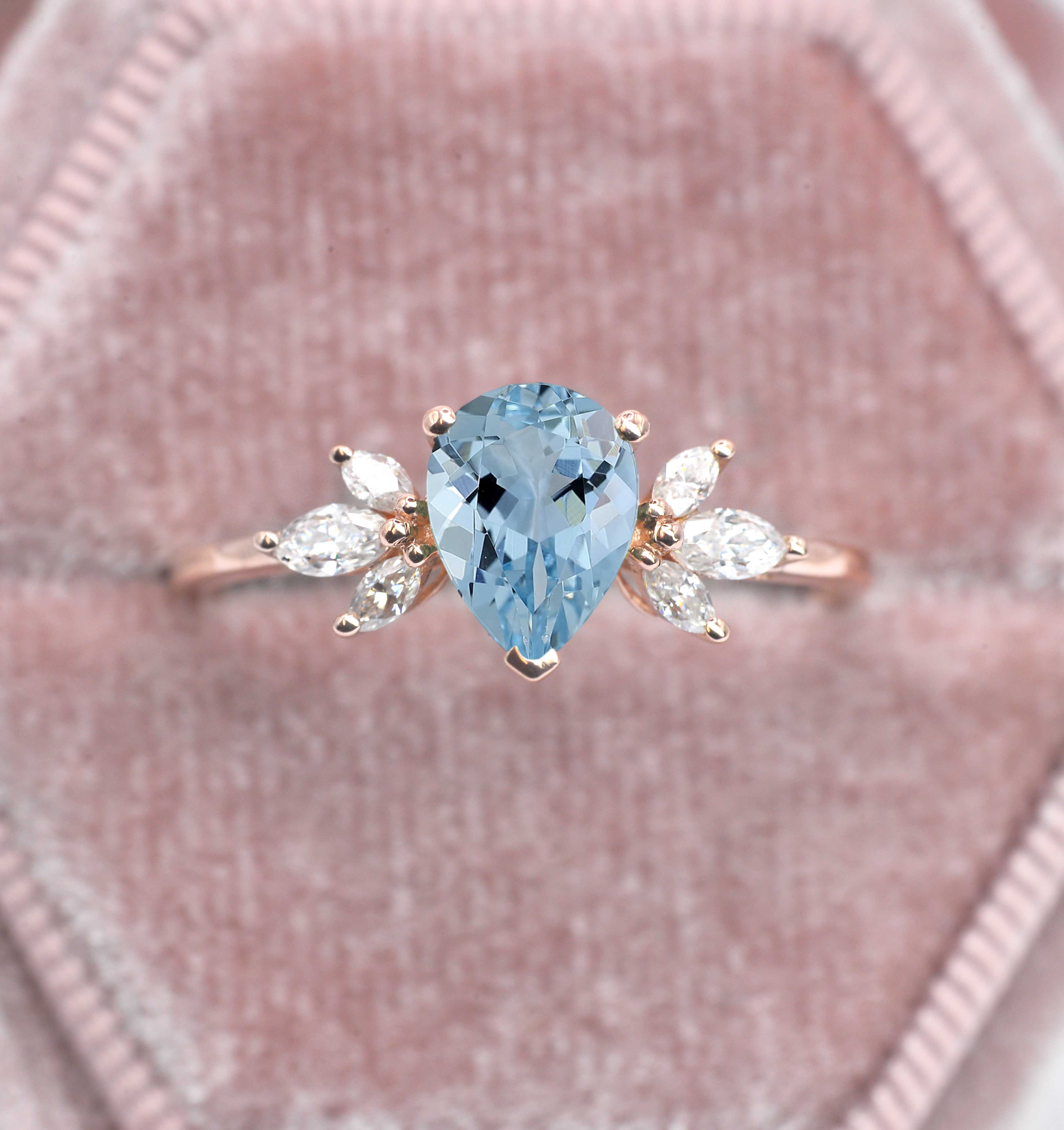 1.5ct pear cut aquamarine and diamond ring with 8 x 6mm aquamarine and white marquise diamonds. The unique design of this art deco style ring comes with solid 9k,14k or 18k gold or platinum.