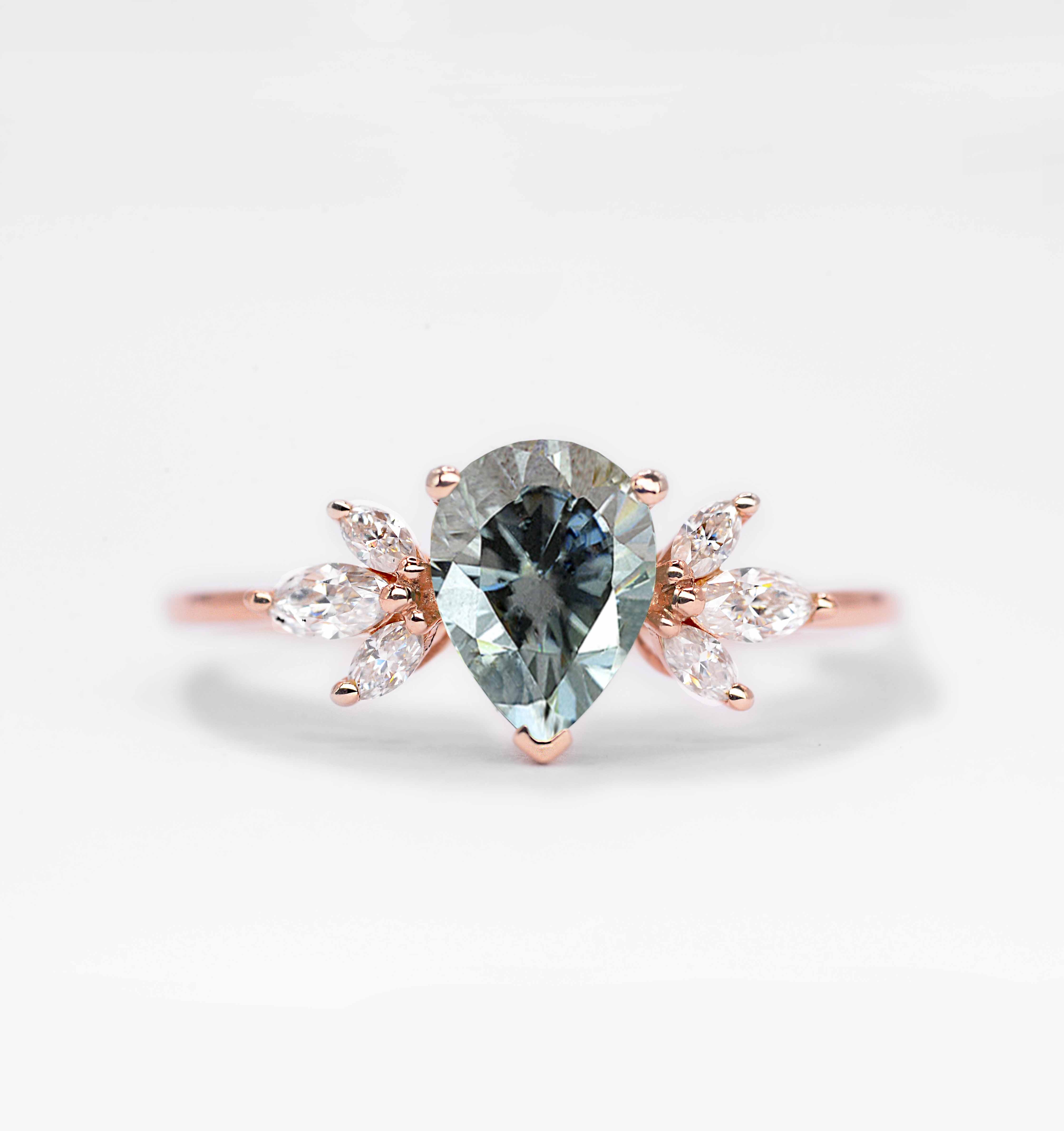pear cut grey moissanite ring with 8 x 6mm peat cut moissanite and white marquise diamonds. The unique design of this art deco style ring comes with solid 9k,14k or 18k gold or platinum.