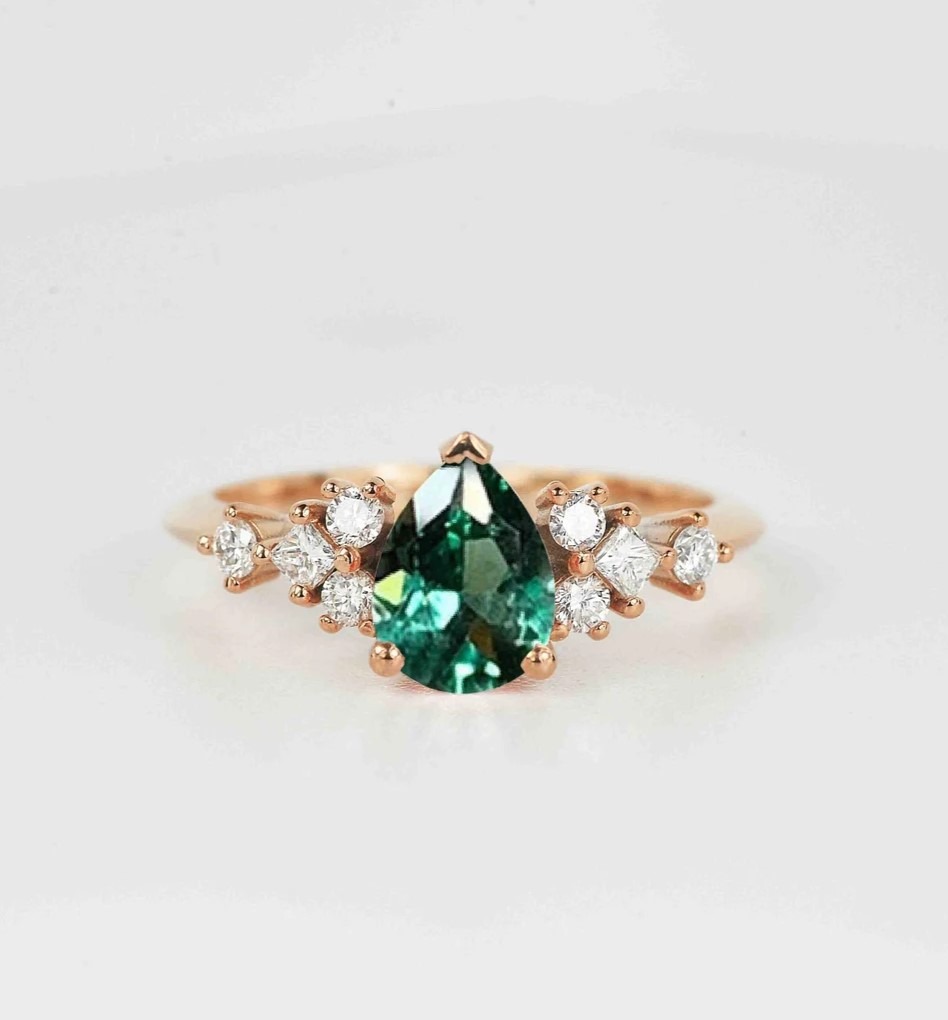 This beautiful pear cut mint green sapphire ring comes with a center 1.50ct mint green sapphire and white natural diamonds. Available in rose gold, yellow gold, white gold, or platinum.