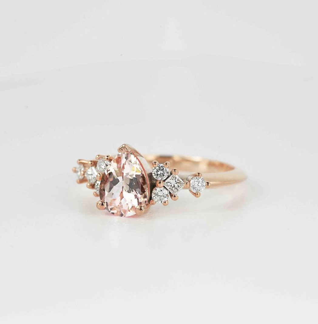 pear cut morganite unique ring with morganite and white accent diamonds. This unique art deco ring comes with solid 9k,14k or 18k rose gold.