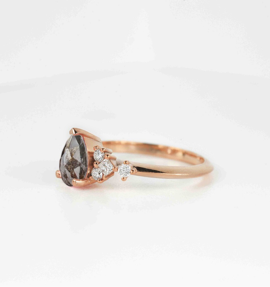 pear cut salt and pepper diamond ring with white accent diamonds. This unique art deco ring comes with solid 9k,14k or 18k rose gold.