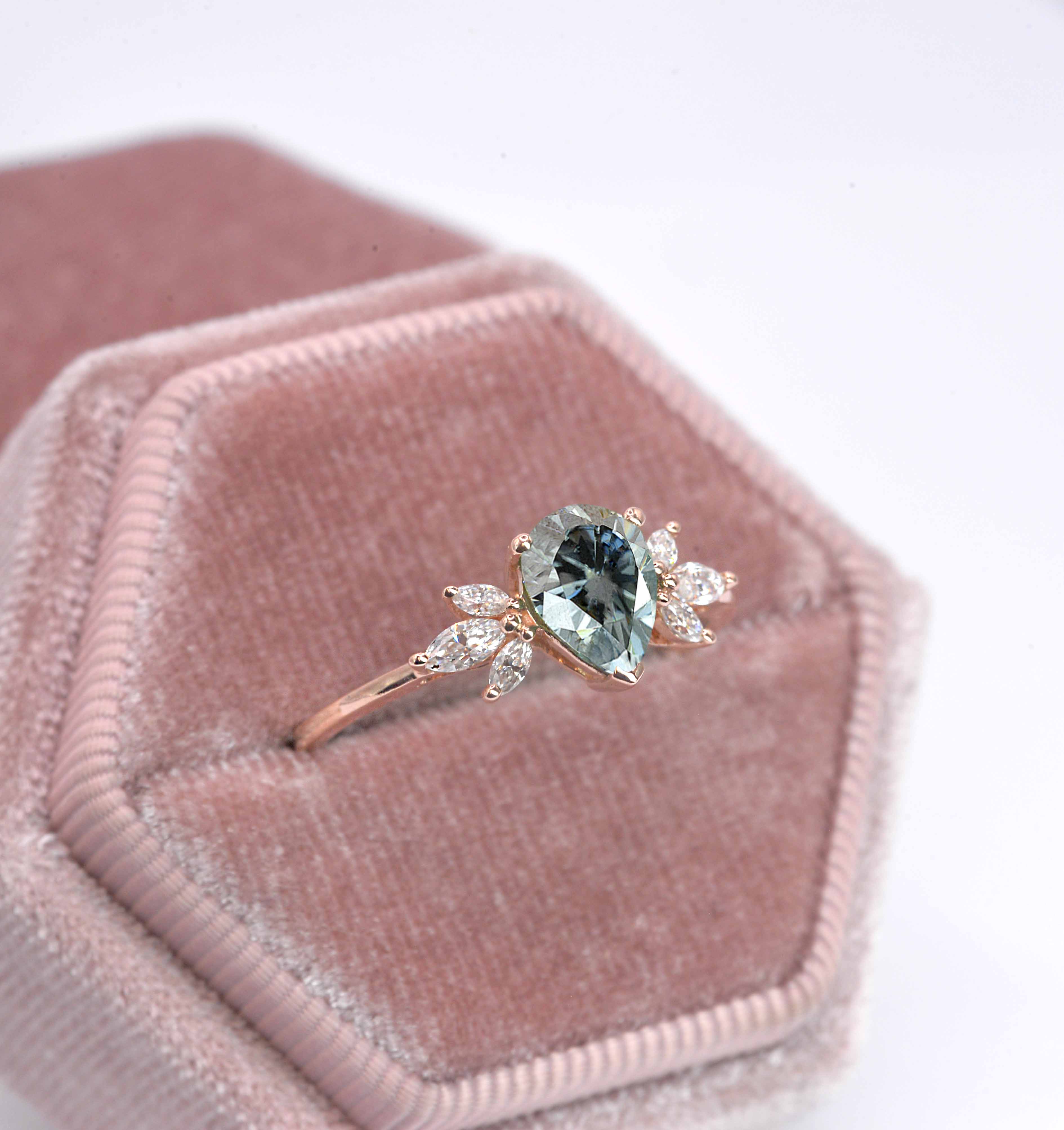 pear cut grey moissanite ring with 8 x 6mm peat cut moissanite and white marquise diamonds. The unique design of this art deco style ring comes with solid 9k,14k or 18k gold or platinum.