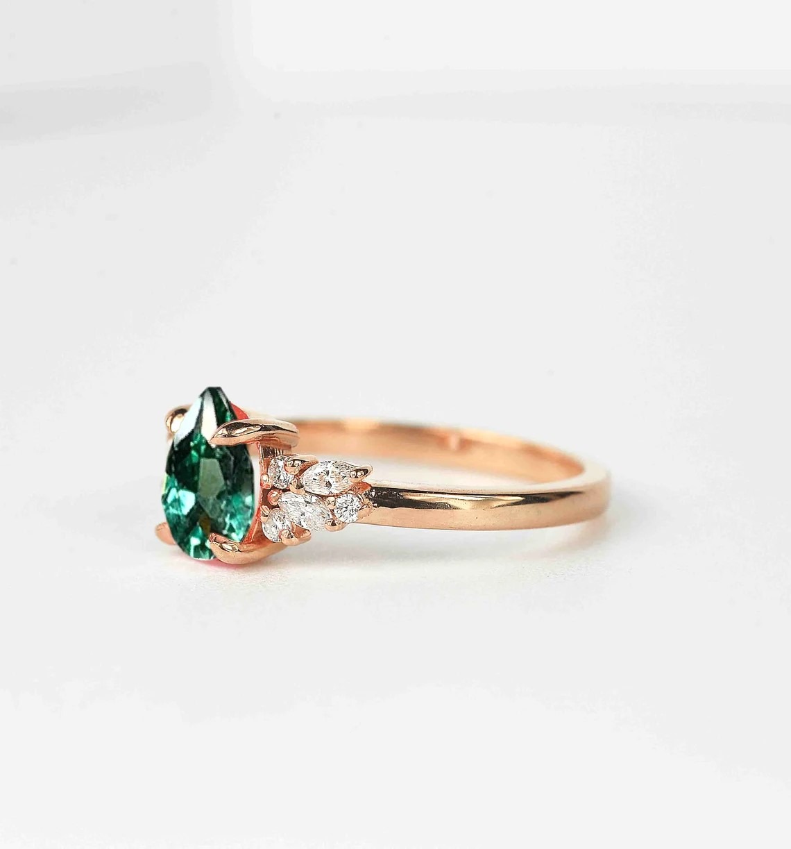 mint green sapphire diamond cluster ring with 8 x 6mm mint green sapphire and white accent diamonds. The unique design of this art deco style ring comes with solid 9k,14k or 18k gold or platinum.