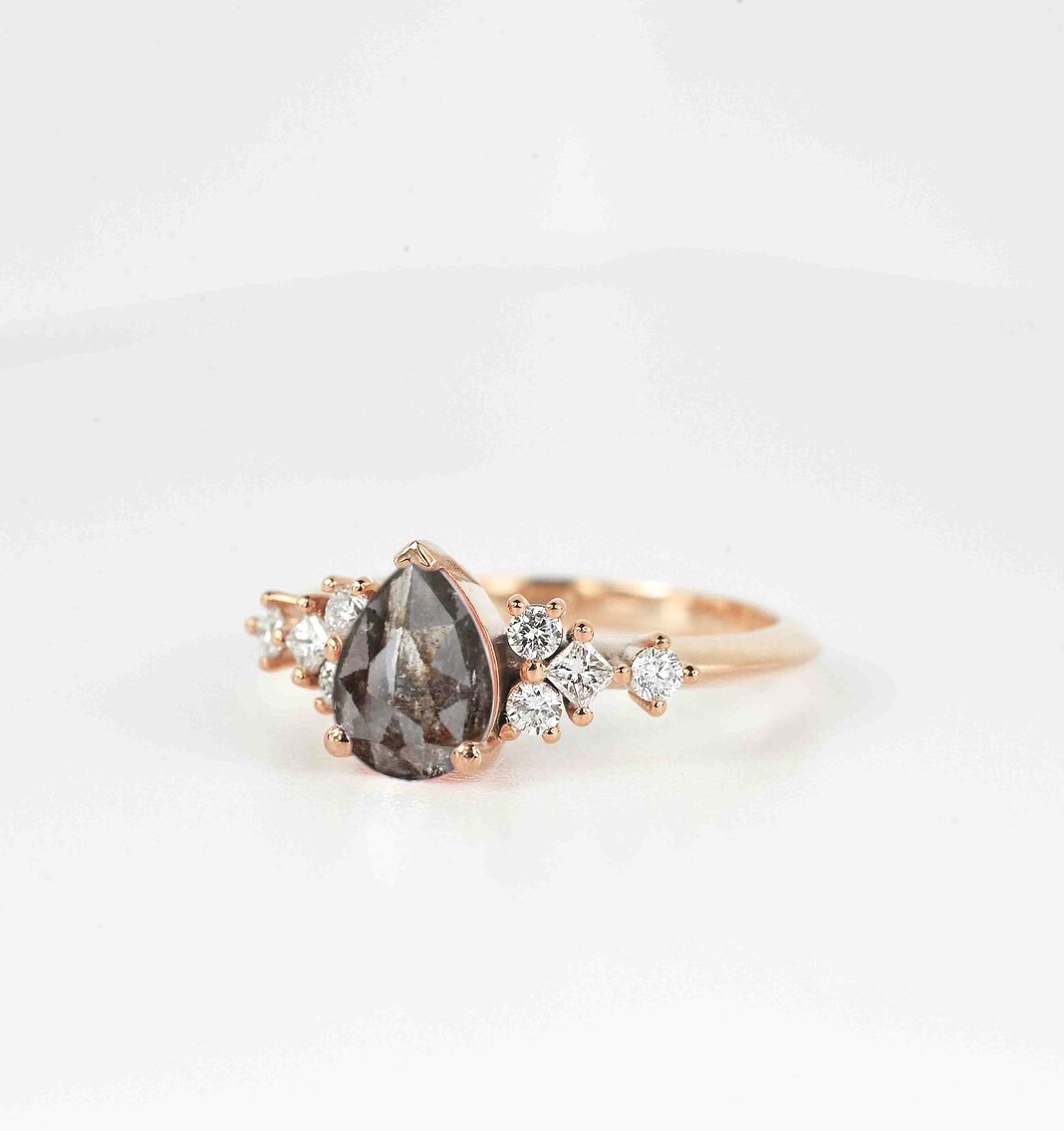 pear cut salt and pepper diamond ring with white accent diamonds. This unique art deco ring comes with solid 9k,14k or 18k rose gold.