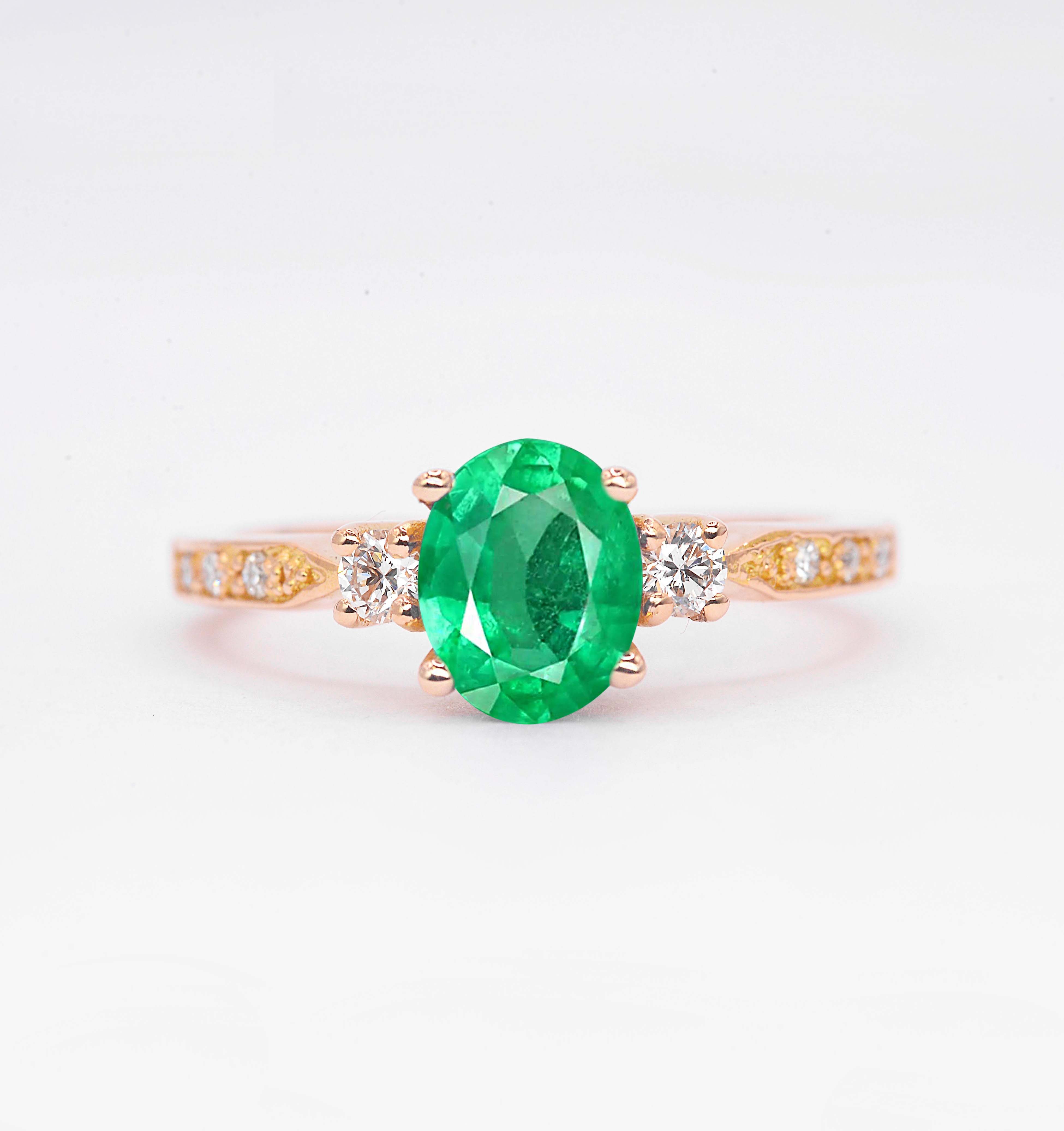 Emerald and diamond rose gold ring