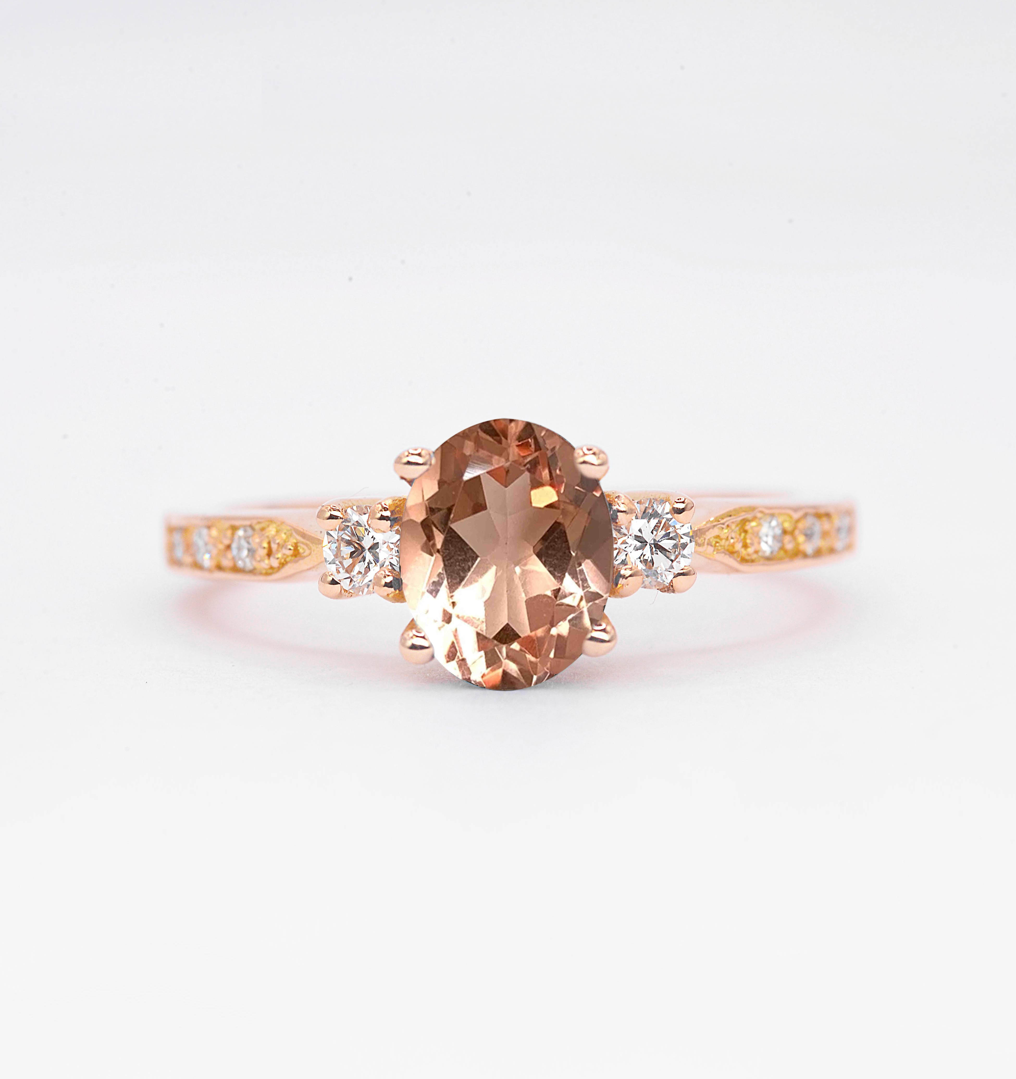 Natural morganite and diamond ring with 8 x 6mm oval cut morganite and white round diamonds. The unique design of this art deco style ring comes with solid 9k,14k or 18k gold or platinum.