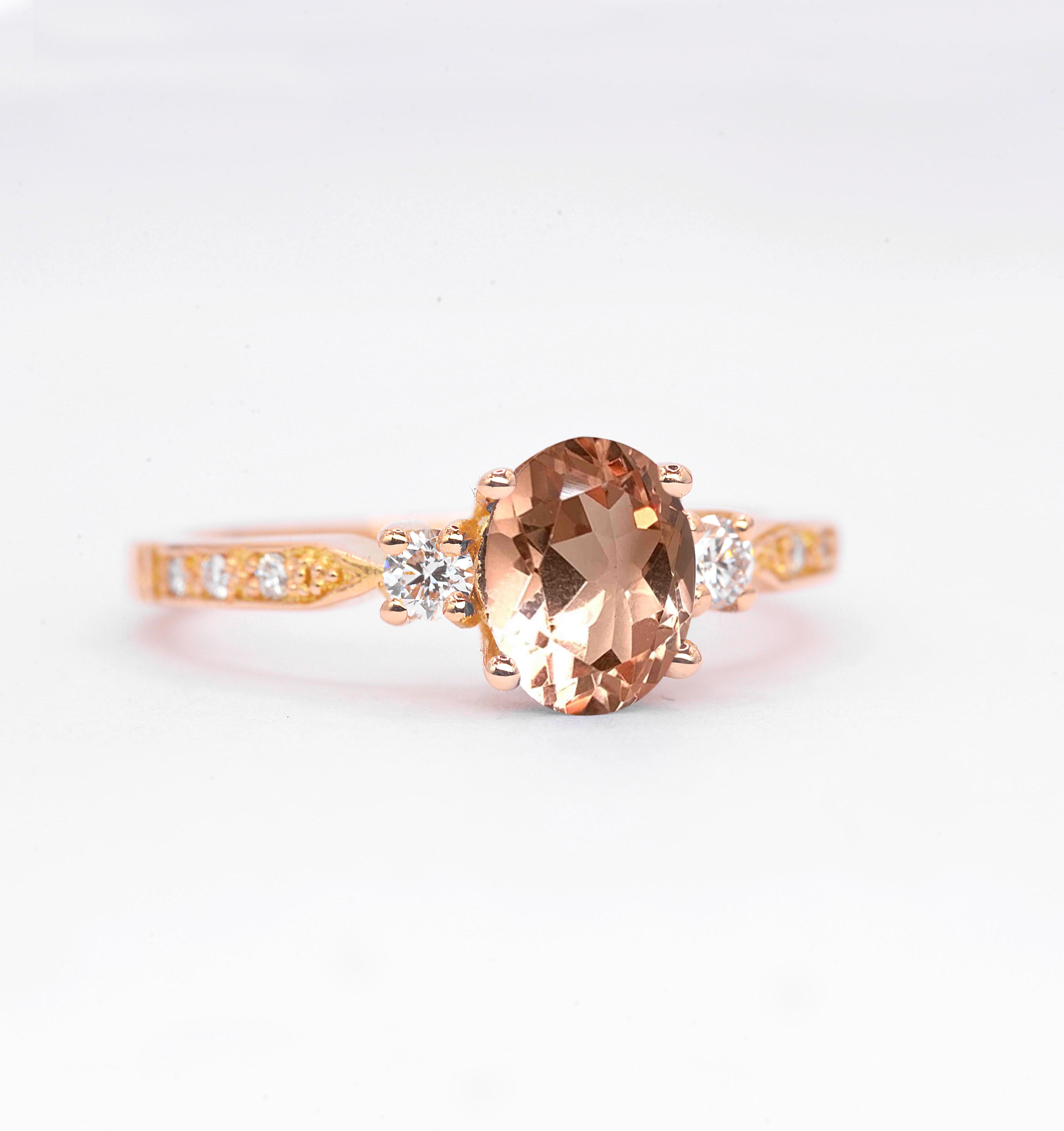 Natural morganite and diamond ring with 8 x 6mm oval cut morganite and white round diamonds. The unique design of this art deco style ring comes with solid 9k,14k or 18k gold or platinum.